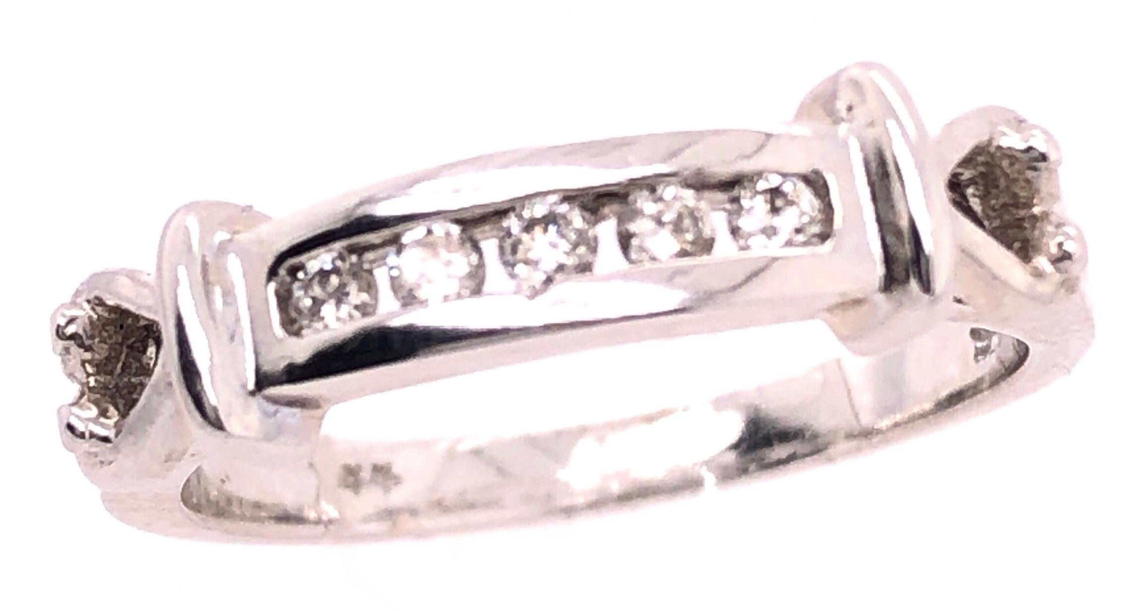 14 Karat White Gold Fashion Ring with Diamonds 0.25 Total Diamond Weight.
Size 7
3.3 grams total weight.
