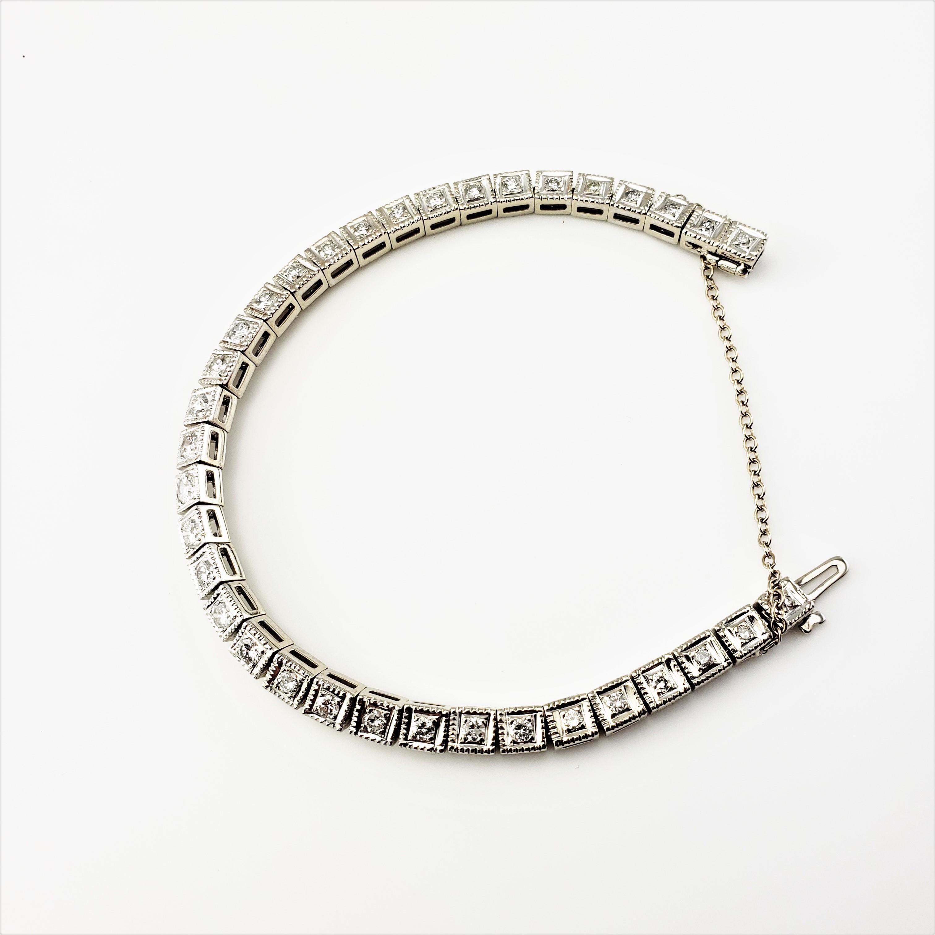 14 Karat White Gold Diamond Bracelet-

This sparkling bracelet features 31 round brilliant cut diamonds and 4 round single cut diamonds set in classic 14K white gold.  Safety chain closure.  Width:  5 mm.

Approximate total diamond weight:  1.15