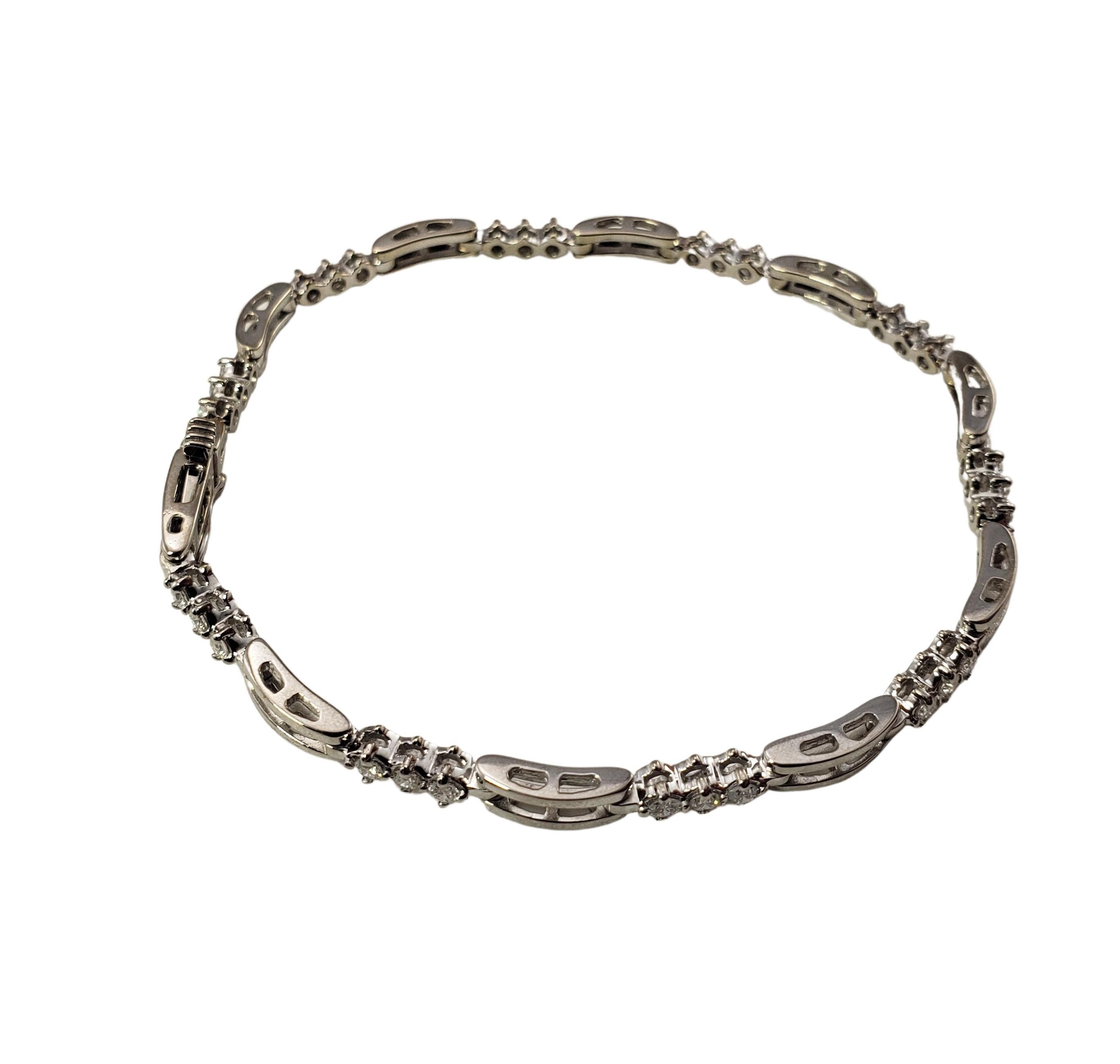 14 Karat White Gold and Diamond Bracelet-

This sparkling bracelet features 30 round brilliant cut diamonds set in beautifully detailed 14K white gold.  Width:  3 mm.

Approximate total diamond weight:  .90 ct.

Diamond color: H-I

Diamond clarity: 