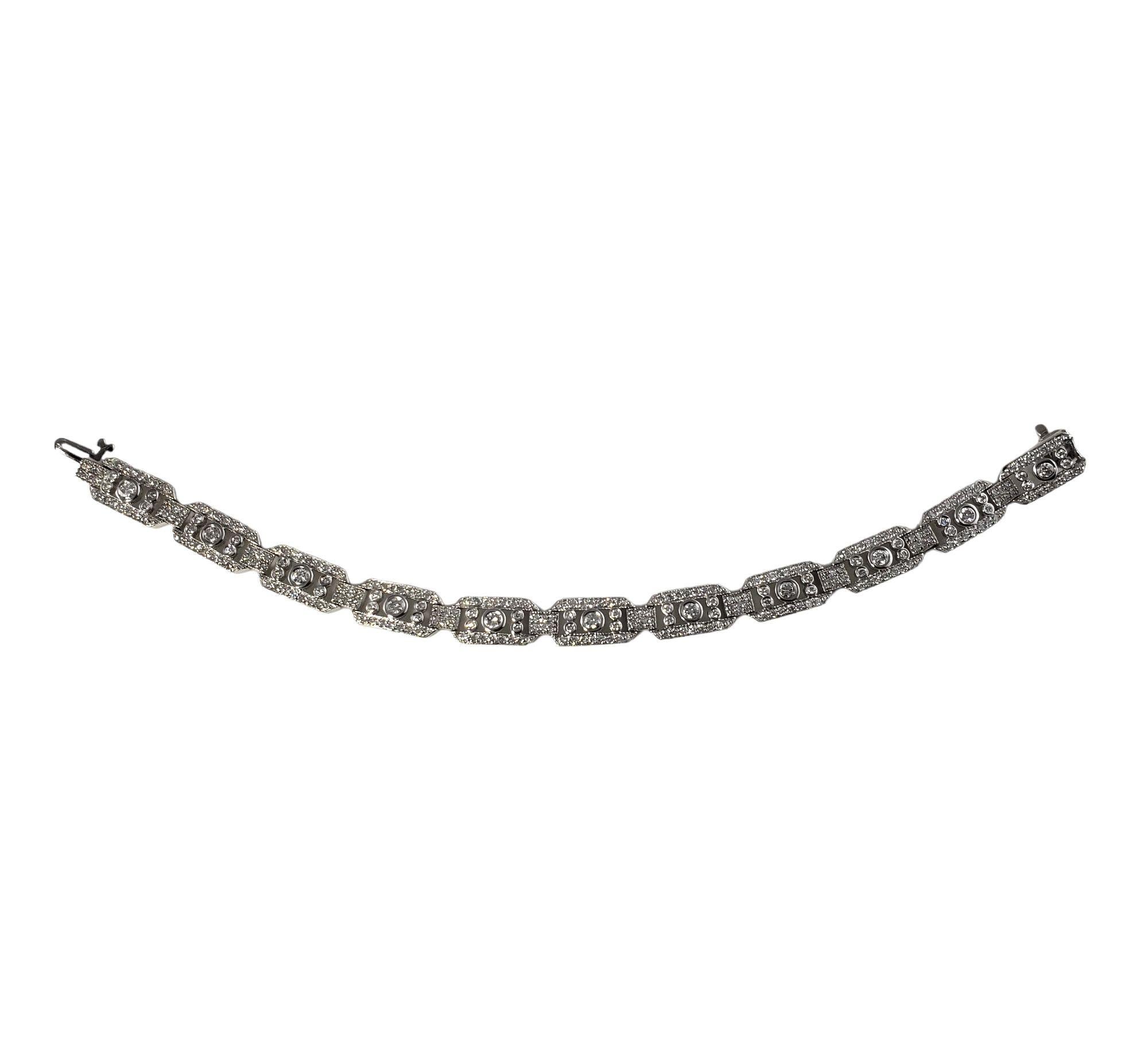 Vintage 14 Karat White Gold and Diamond Bracelet-

This sparkling bracelet features 275 round brilliant cut diamonds set in beautifully detailed 14K white gold. Width: 8 mm.

Total diamond weight: 3.30 ct.

Diamond color: G-H

Diamond clarity:
