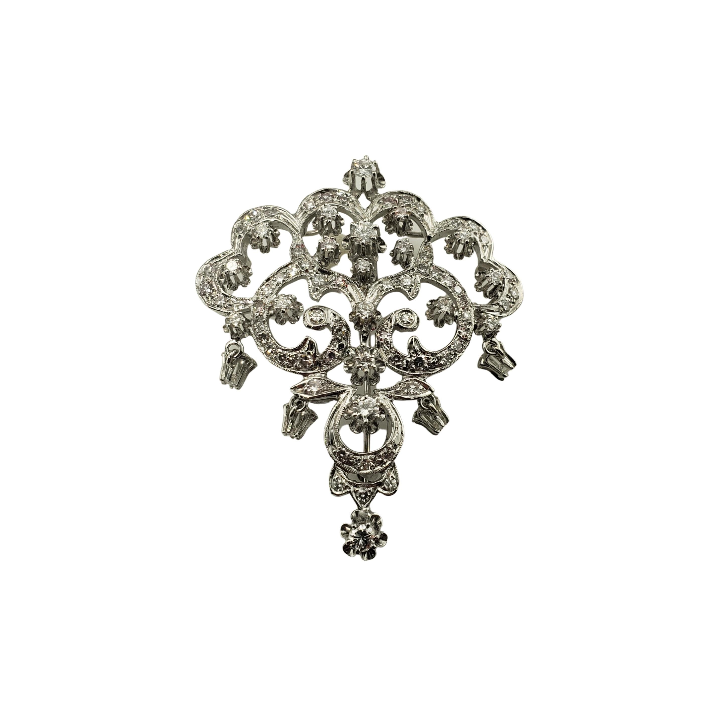 Vintage 14 Karat White Gold and Diamond Brooch-

This sparkling brooch features 66 round brilliant cut diamonds set in beautifully detailed 14K white gold.

Approximate total diamond weight: 1.25 ct.

Diamond clarity: VS1

Diamond color: G

Size: 2