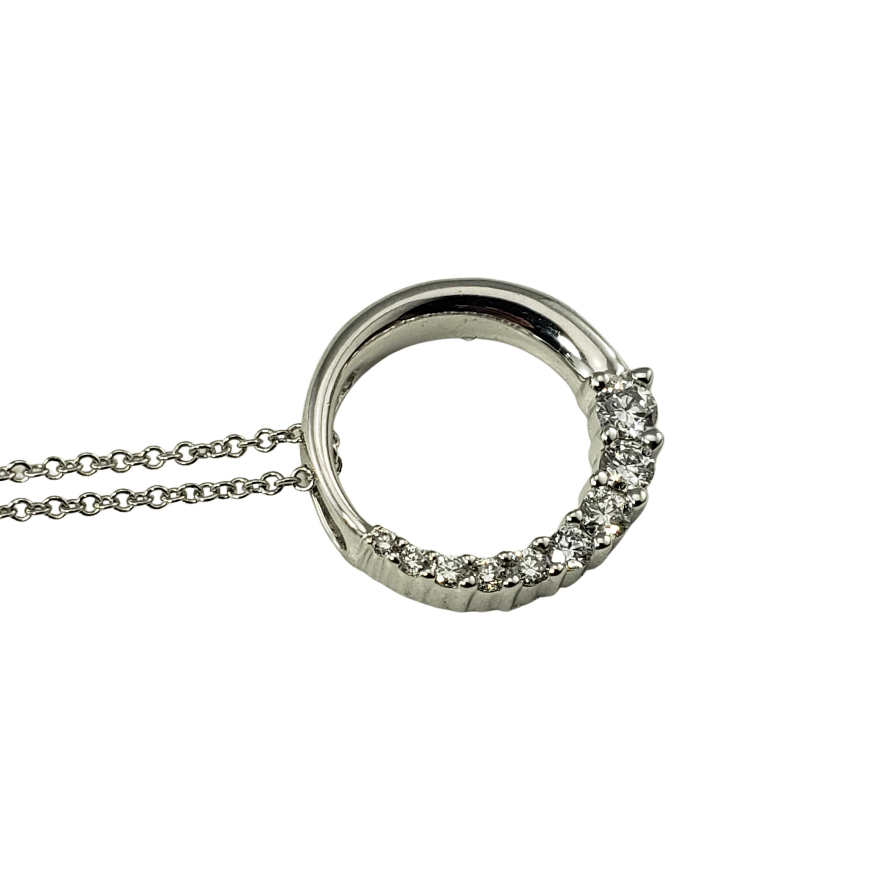14 Karat White Gold and Diamond Circle Pendant Necklace-

This lovely circle pendant features nine round brilliant cut diamonds set in  14K white gold and suspended from a classic cable necklace.  

Approximate total diamond weight:  .25