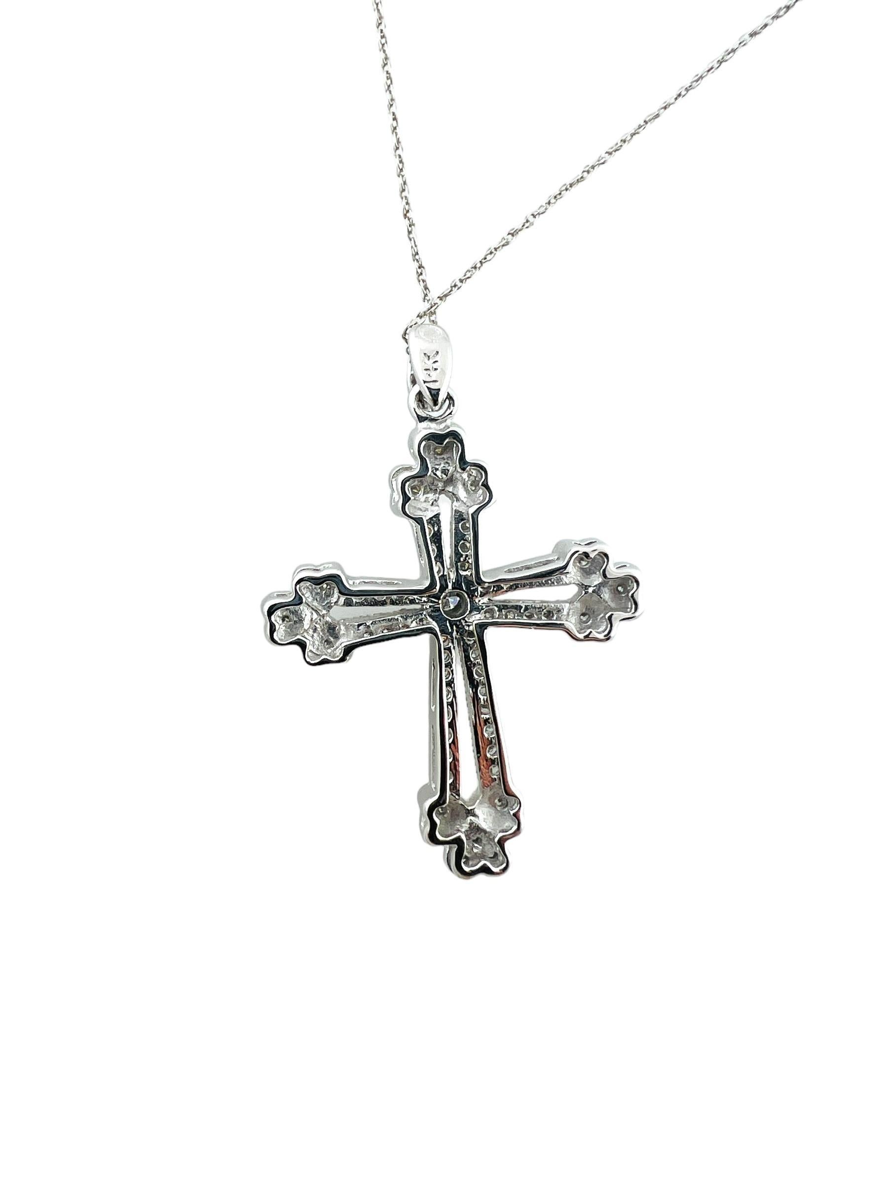 This sparkling cross pendant features 56 round brilliant cut diamonds set in beautifully detailed 14K white gold. Suspends from a classic cable necklace.

Approximate diamond weight: .30 ct.

Diamond color: G

Diamond clarity: SI1-VS2

Stamped: