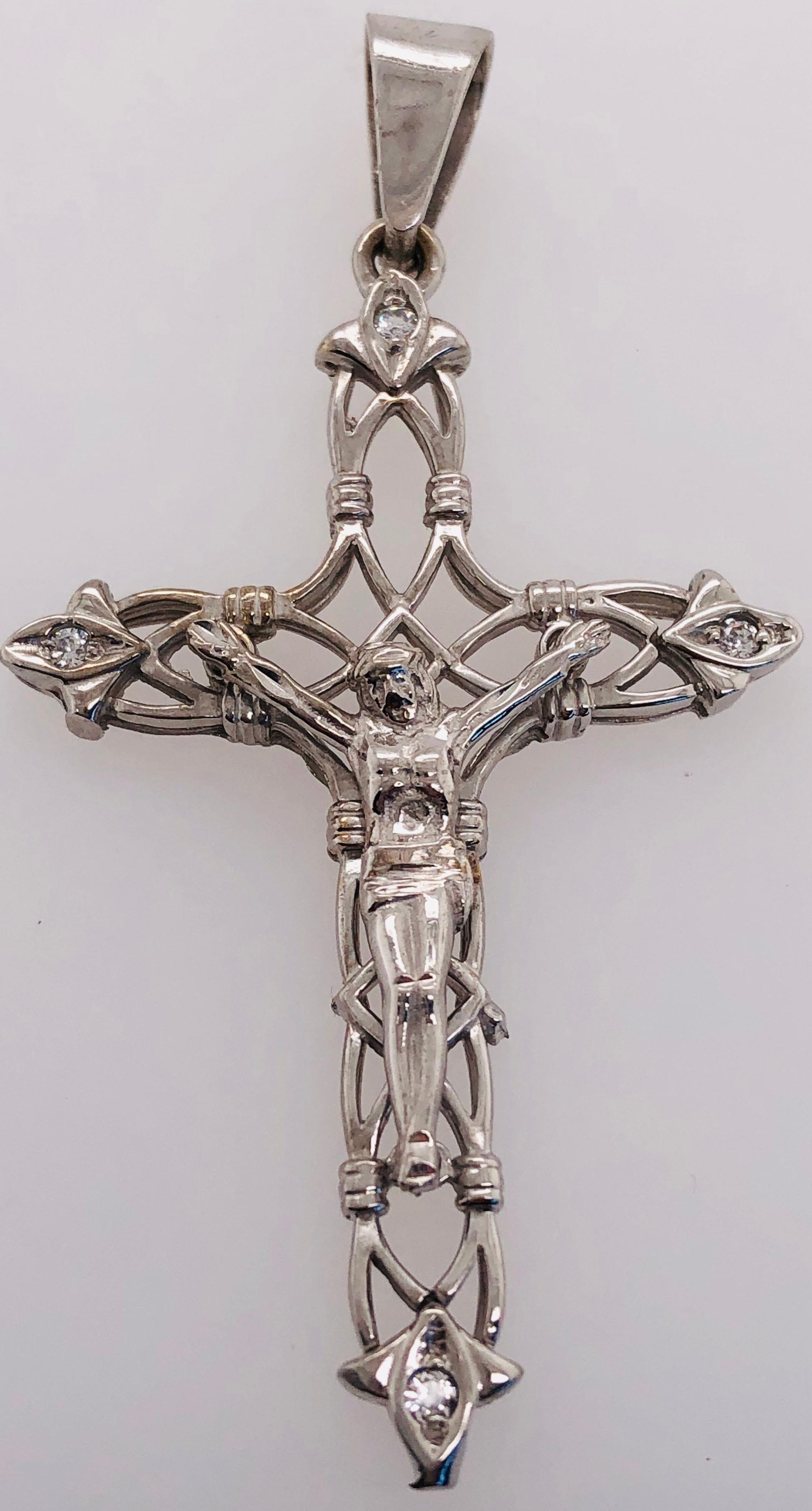 14 Karat White Gold And Diamond Cross / Religious Pendant 
5.70 grams Total weight