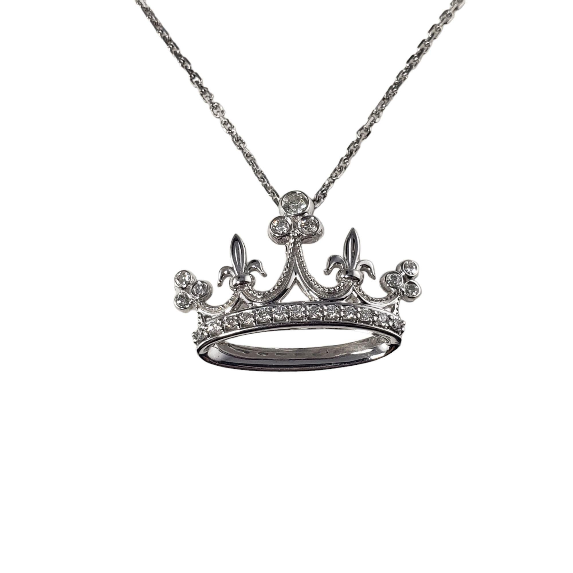 Vintage 14 Karat White Gold and Diamond Crown Pendant Necklace-

This lovely crown pendant features 22 round brilliant cut diamonds set in classic 14K white gold. Suspends from a classic 14K white gold chain.

Approximate total diamond weight: .25