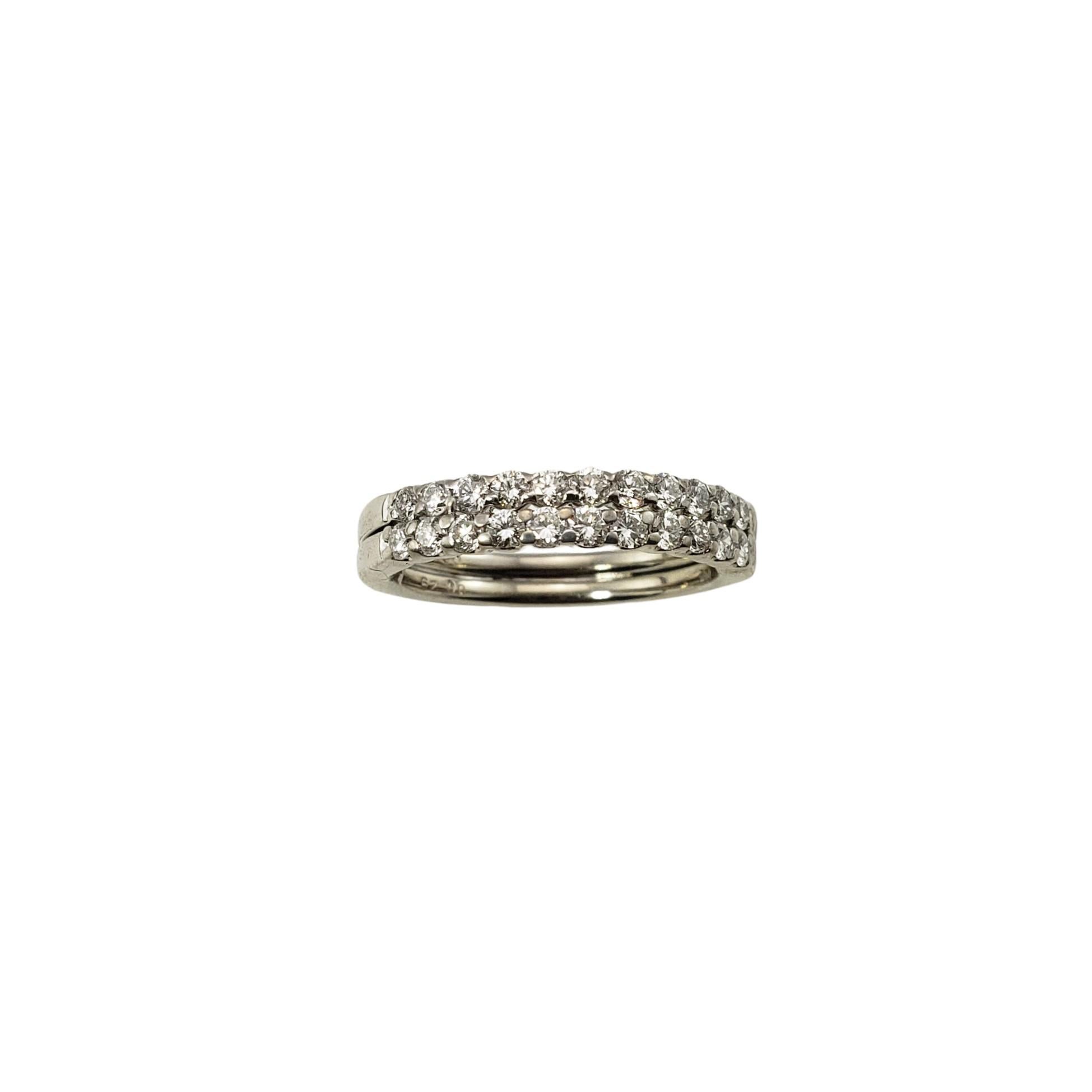 14 Karat White Gold and Diamond Double Band Ring Size 6.5-

This sparkling 14K white gold ring features 22 round brilliant cut diamonds set in a fixed double band setting.  Width:  4 mm.
Shank:  3 mm.

Approximate total diamond weight:  .58