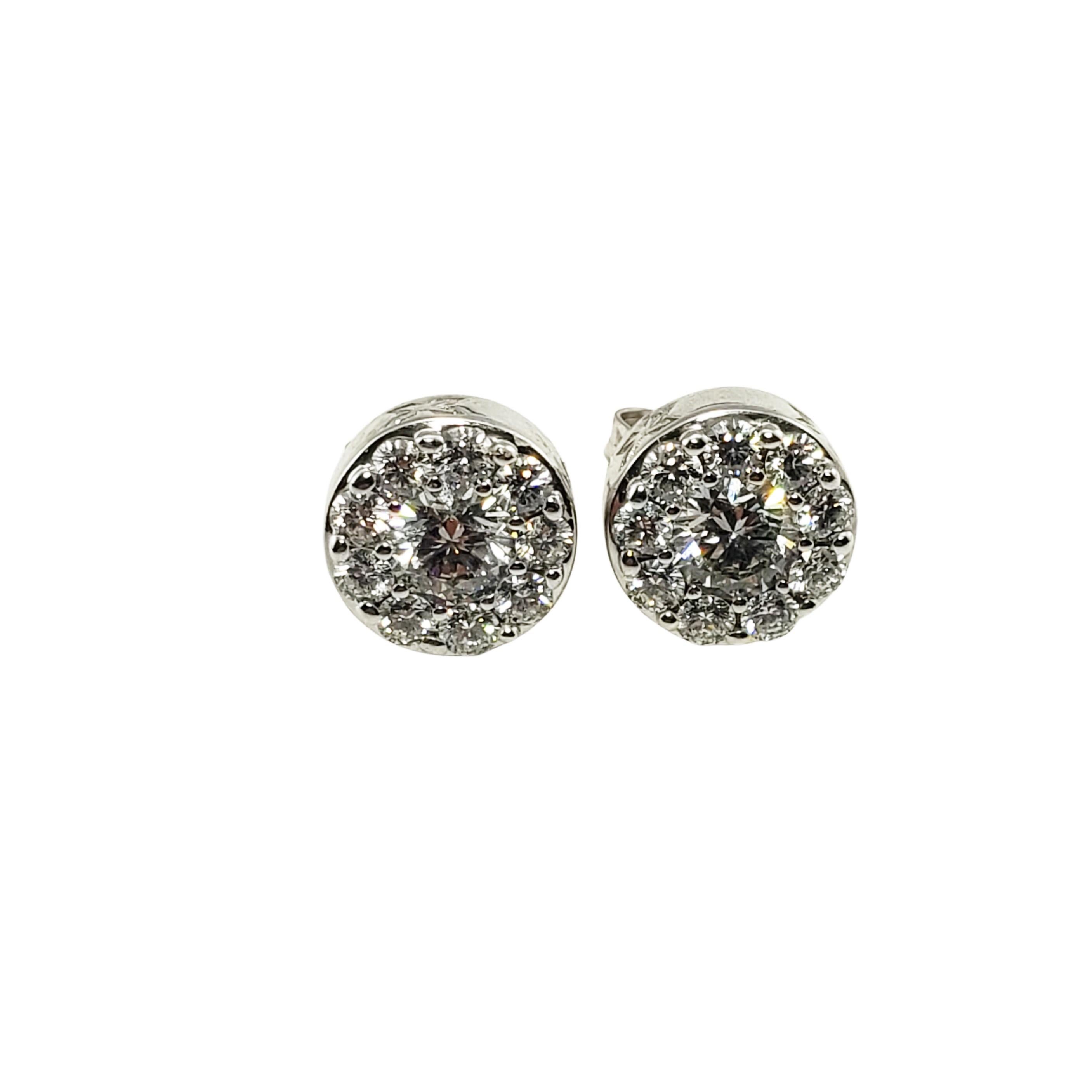 14 Karat White Gold and Diamond Earrings-

These sparkling stud earrings each feature 20 round brilliant cut diamonds set in classic 14K white gold.  Push back closures.

Total diamond weight: 1.47 ct.

Diamond color: H-K

Diamond clarity: