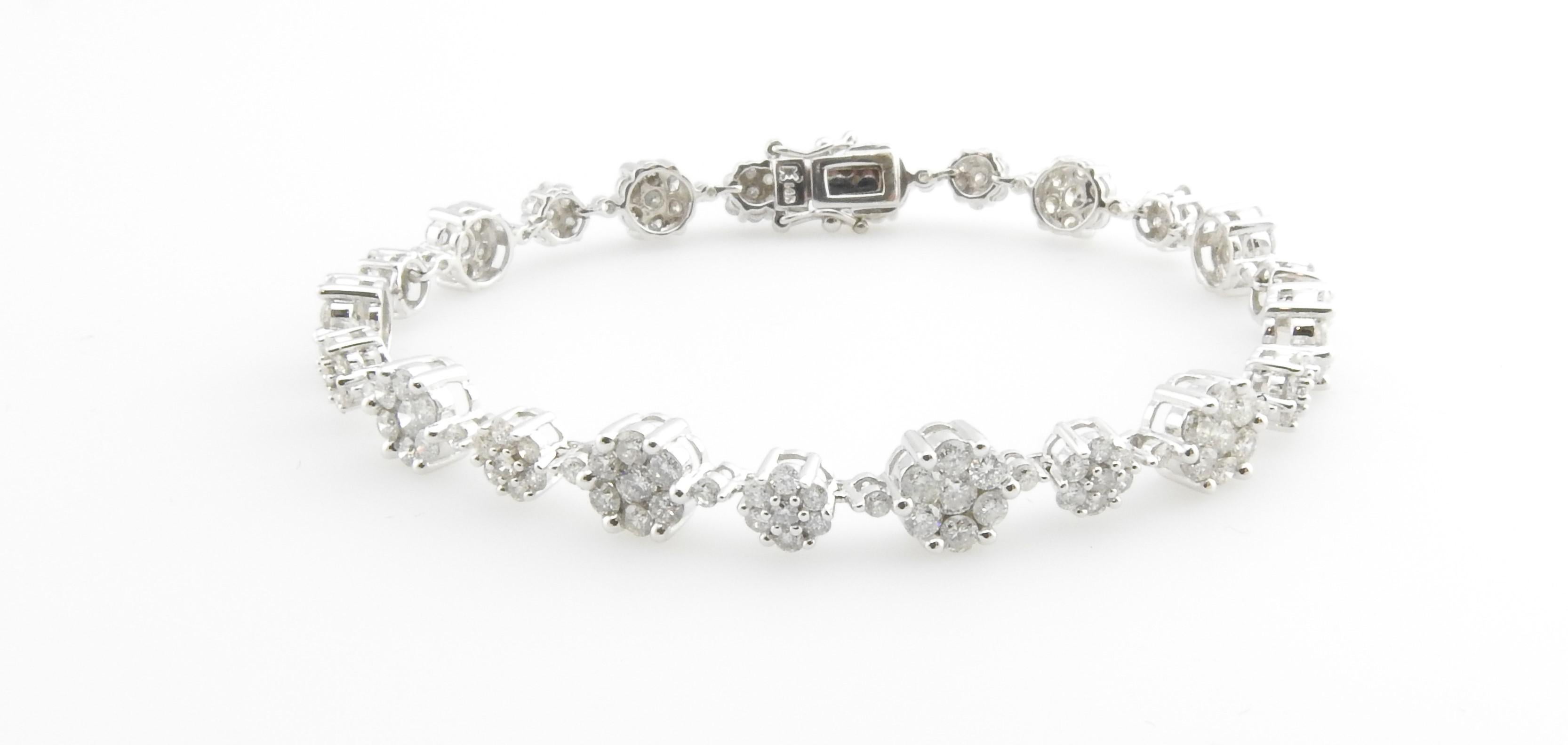 Vintage 14 Karat White Gold Diamond Bracelet

This spectacular bracelet features 164 round brilliant cut diamonds set in beautifully detailed 14K white gold. Width: 6 mm.

Approximate total diamond weight: 4.17 cts.

Diamond color: H-I

Diamond