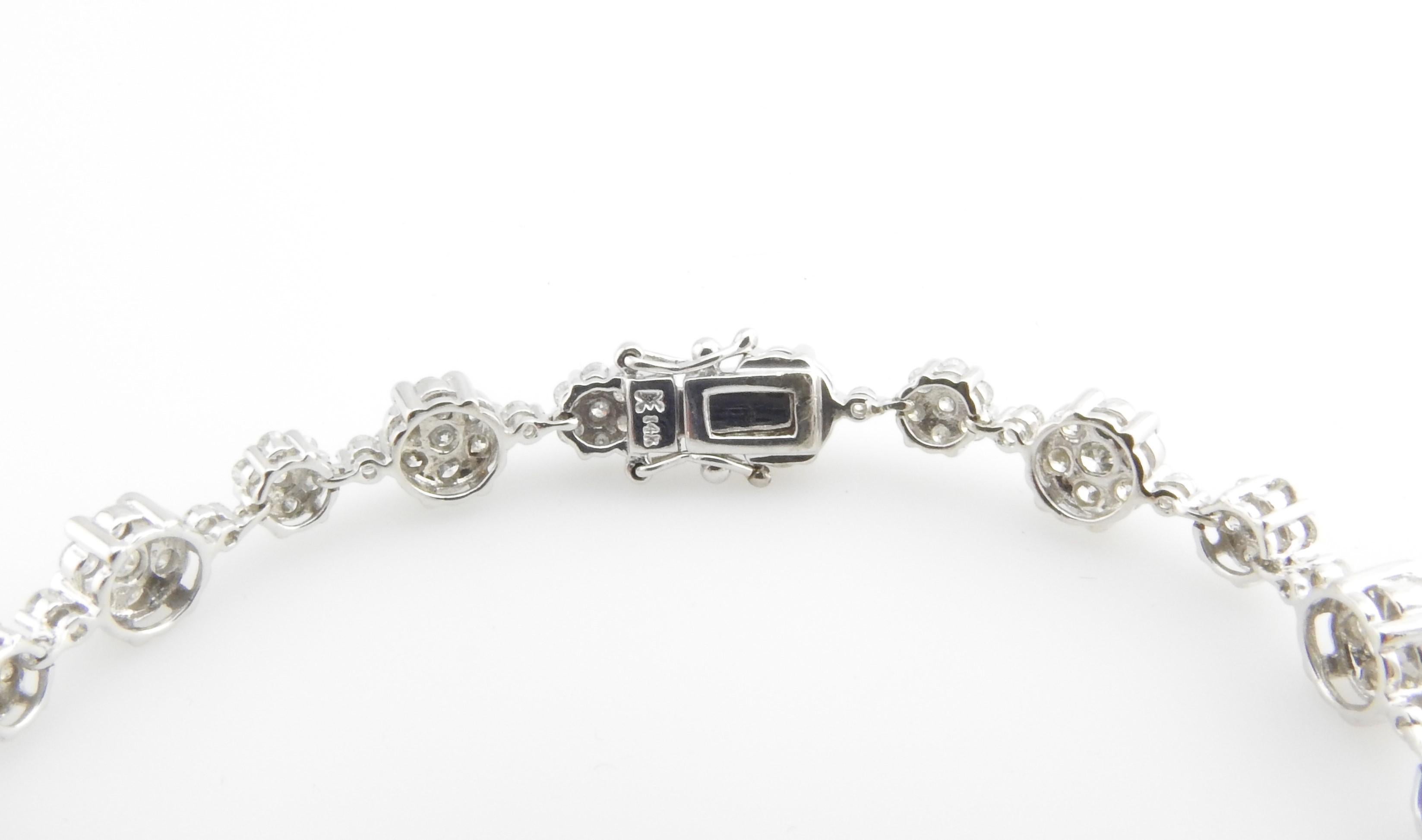 14 Karat White Gold and Diamond Floral Tennis Bracelet In Good Condition In Washington Depot, CT