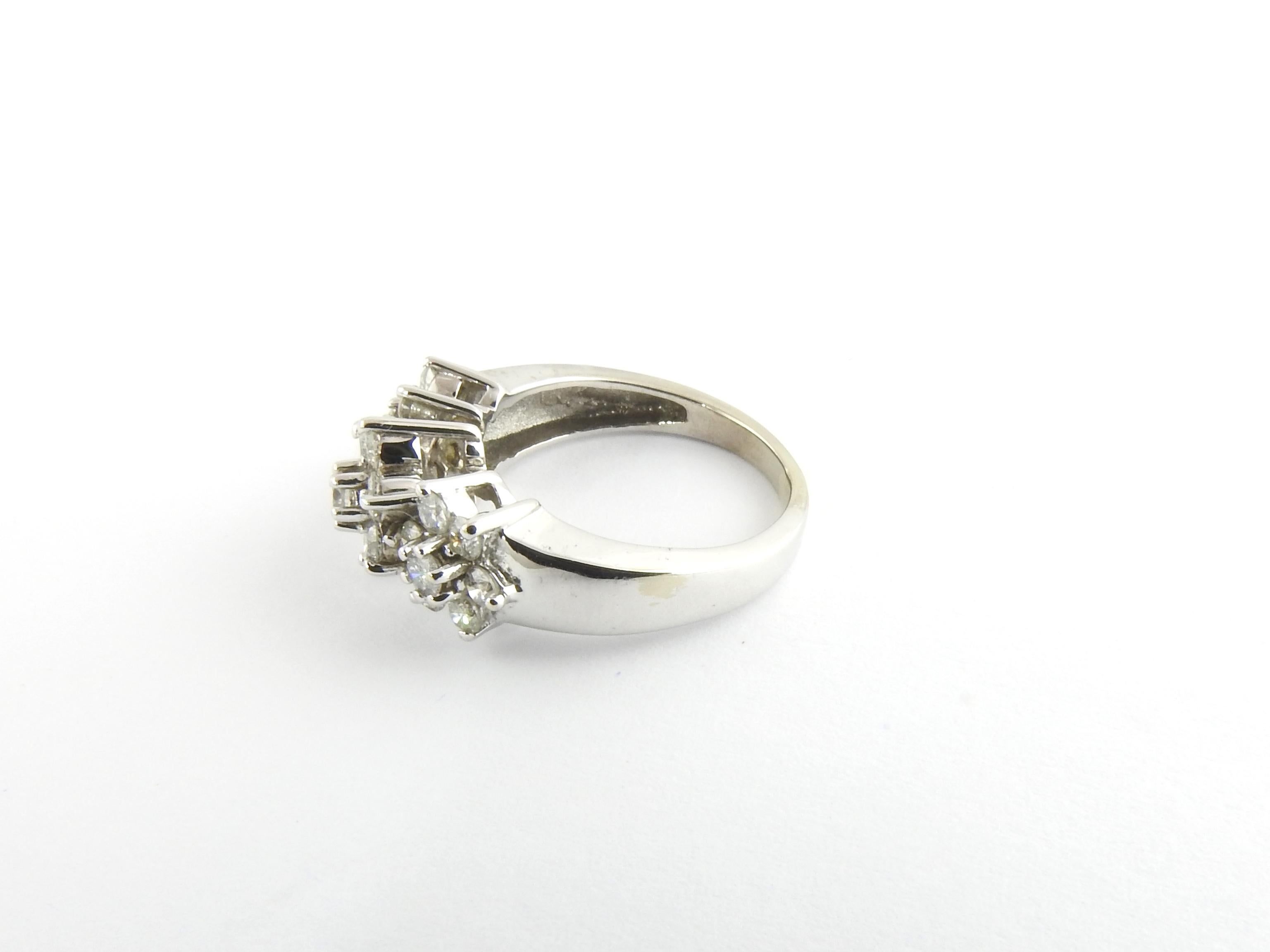 Vintage 14 Karat White Gold and Diamond Flower Ring Size 6

This sparkling ring features 21 round brilliant cut diamonds set in a stunning floral setting.

Width: 9 mm.
Shank: 2 mm.

Approximate total diamond weight: 1.05 ct.

Diamond color: