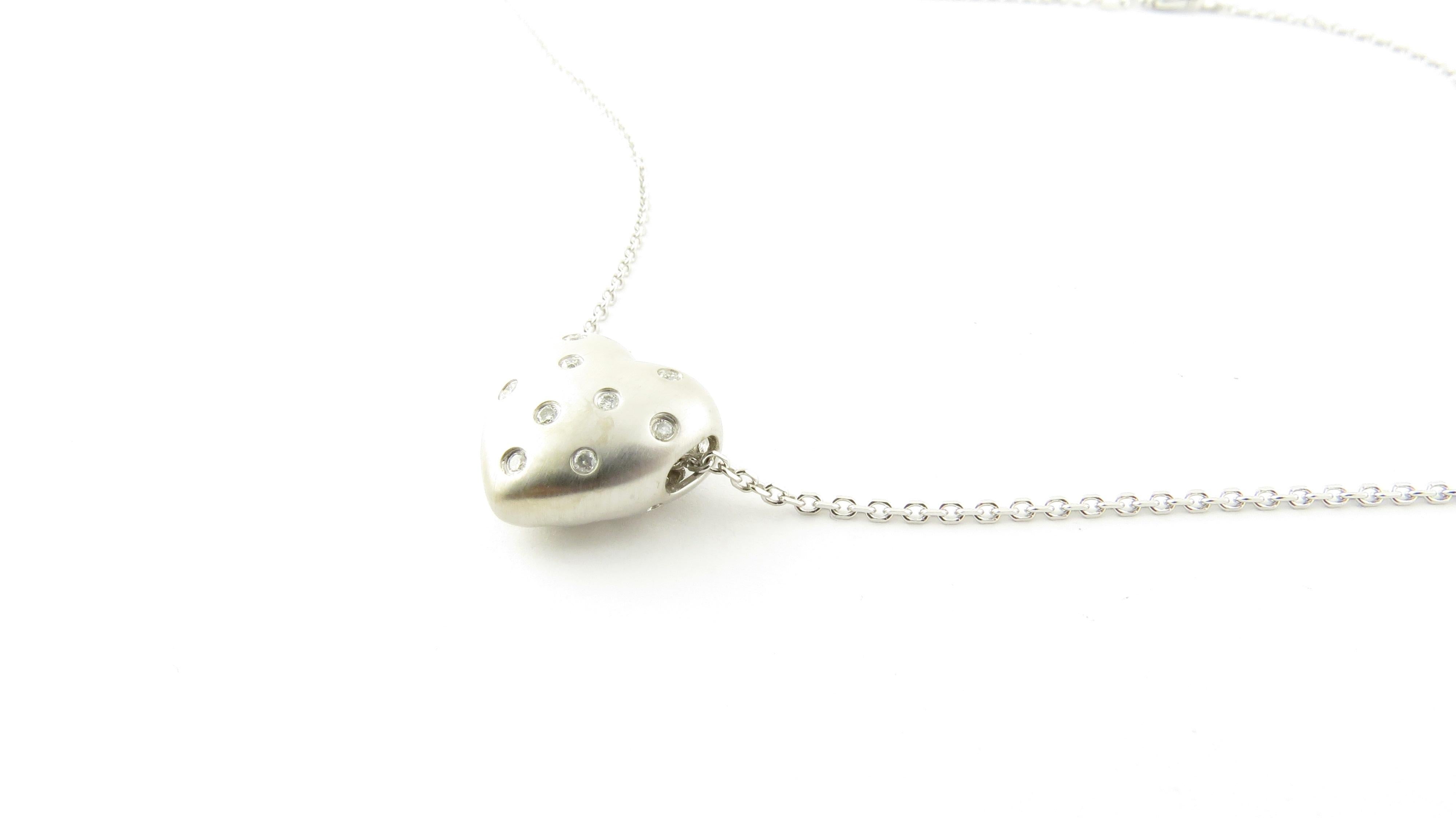 Vintage 14 Karat White Gold and Diamond Heart Pendant Necklace

This romantic heart pendant features nine round brilliant cut diamonds set in matte finish white gold with lovely cut out back detail. Suspended from a classic 16