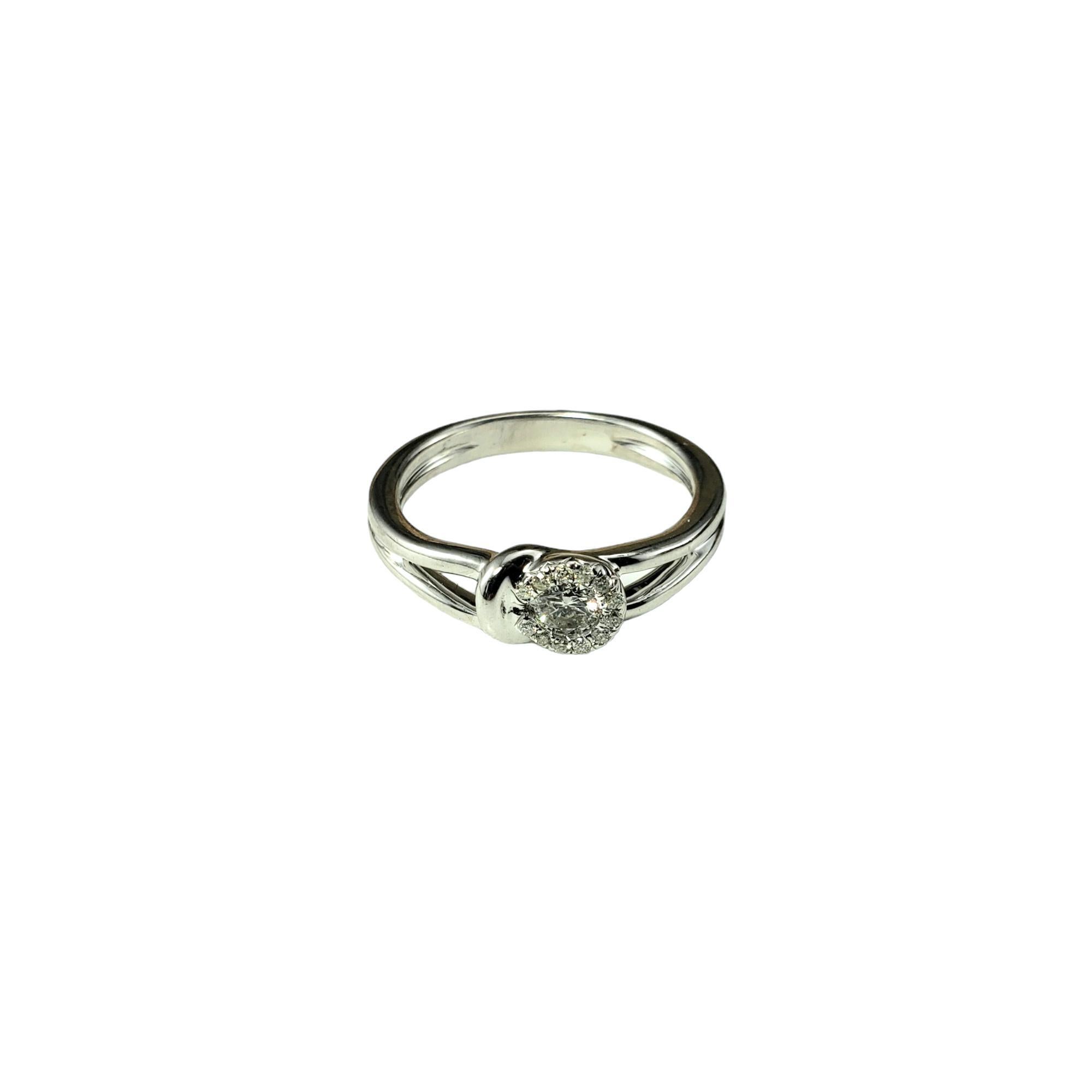 14 Karat White Gold and Diamond Hook and Eye Ring Size 7

This sparkling ring features 13 round brilliant cut diamond set in classic 14K white gold.  

Width: 6 mm.
Shank: 3 mm.

Approximate total diamond weight: .21 ct.

Diamond color: I-J

Diamond