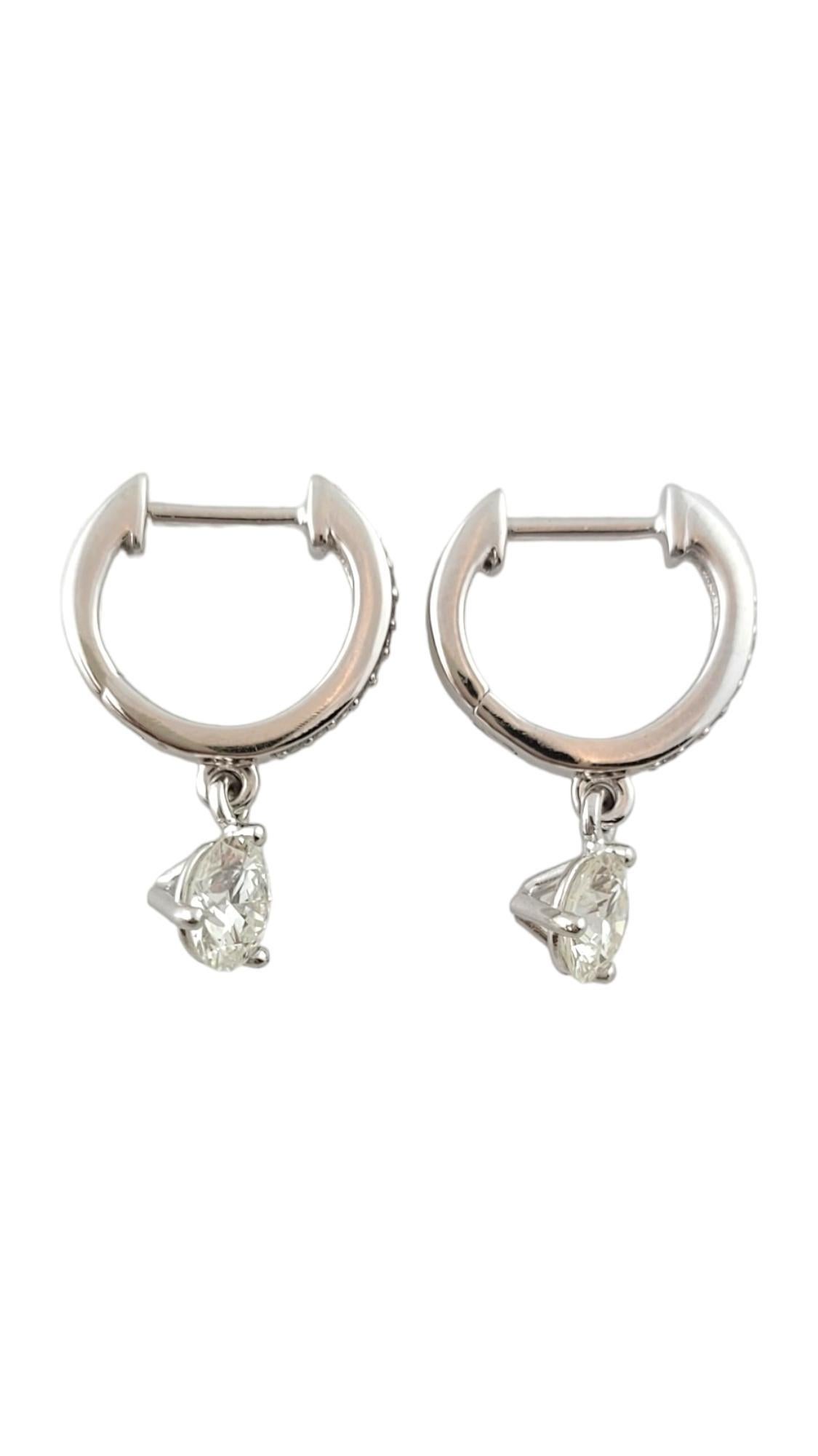 This sparkling hoop earrings each features 12 round brilliant cut diamond set in classic 14K white gold.

Approximate total diamond weight:  1.02 ct.

Diamond color: G-H

Diamond clarity: VS-SI

Size:  13 mm

Weight: 1.6 wt. /  2.5 gr.

Stamped: