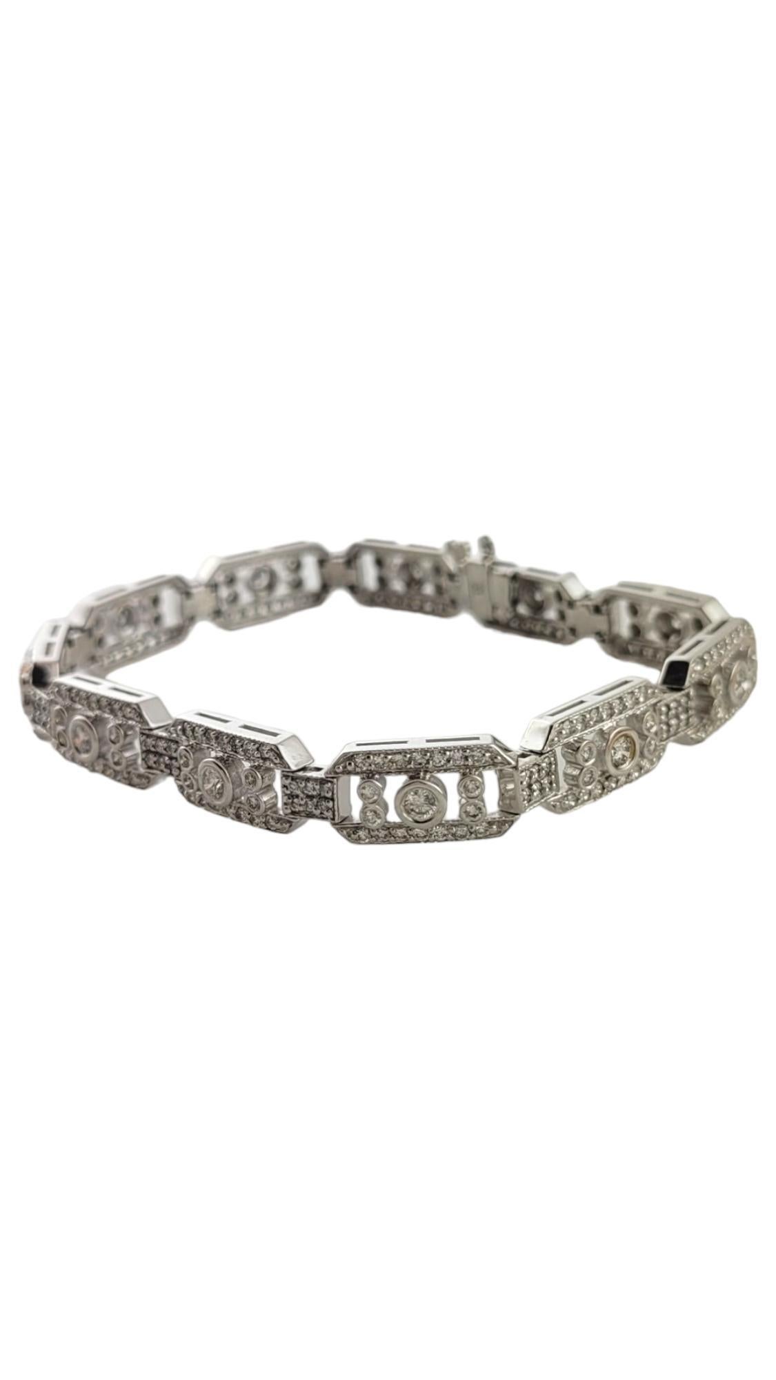 This sparkling bracelet features 275 round brilliant cut diamonds set in beautifully detailed 14K white gold.  Width:  8 mm.

Total diamond weight:  3.30 ct.

Diamond color: G-H

Diamond clarity: SI1-VS2

Size: 6.75 inches

Weight:   11.9 dwt. / 