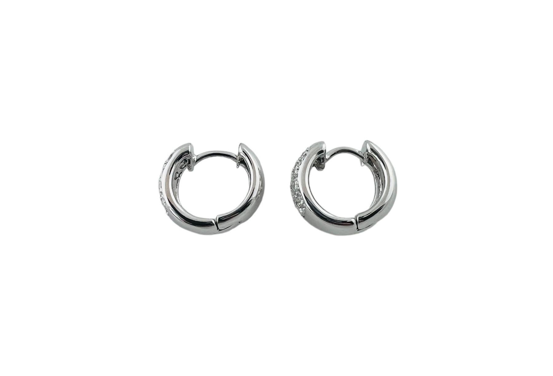 Brilliant Cut 14 Karat White Gold and Diamond Oval Huggie Earrings #20991 For Sale