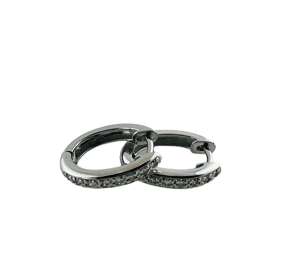 Women's 14 Karat White Gold and Diamond Oval Huggie Earrings #20991 For Sale