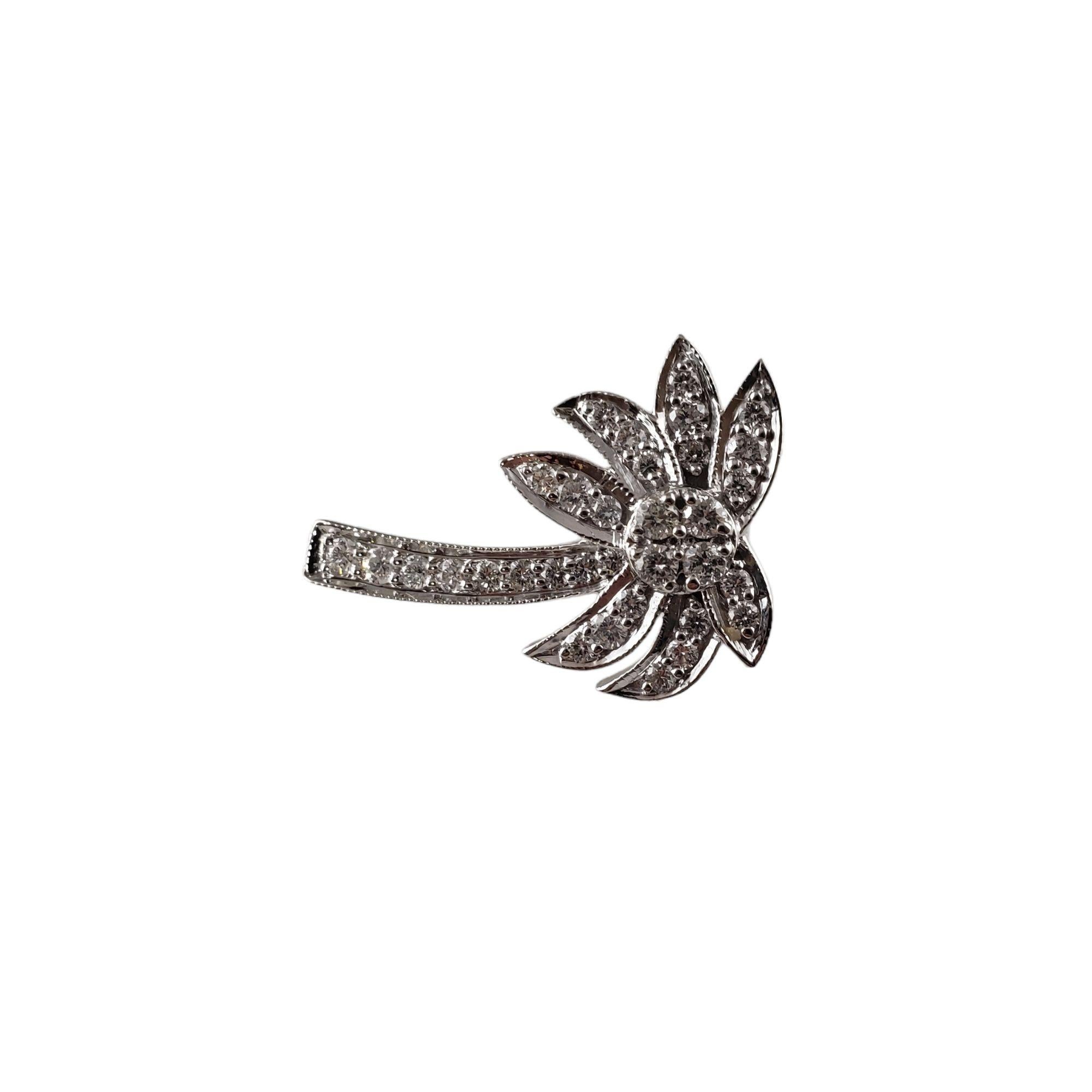 Vintage 14 Karat White Gold and Diamond Palm Tree Pendant-

This sparkling palm tree pendant features 33 round brilliant cut diamonds set in classic 14K white gold.

*Chain not included.

Approximate total diamond weight: .85 ct.

Diamond color: