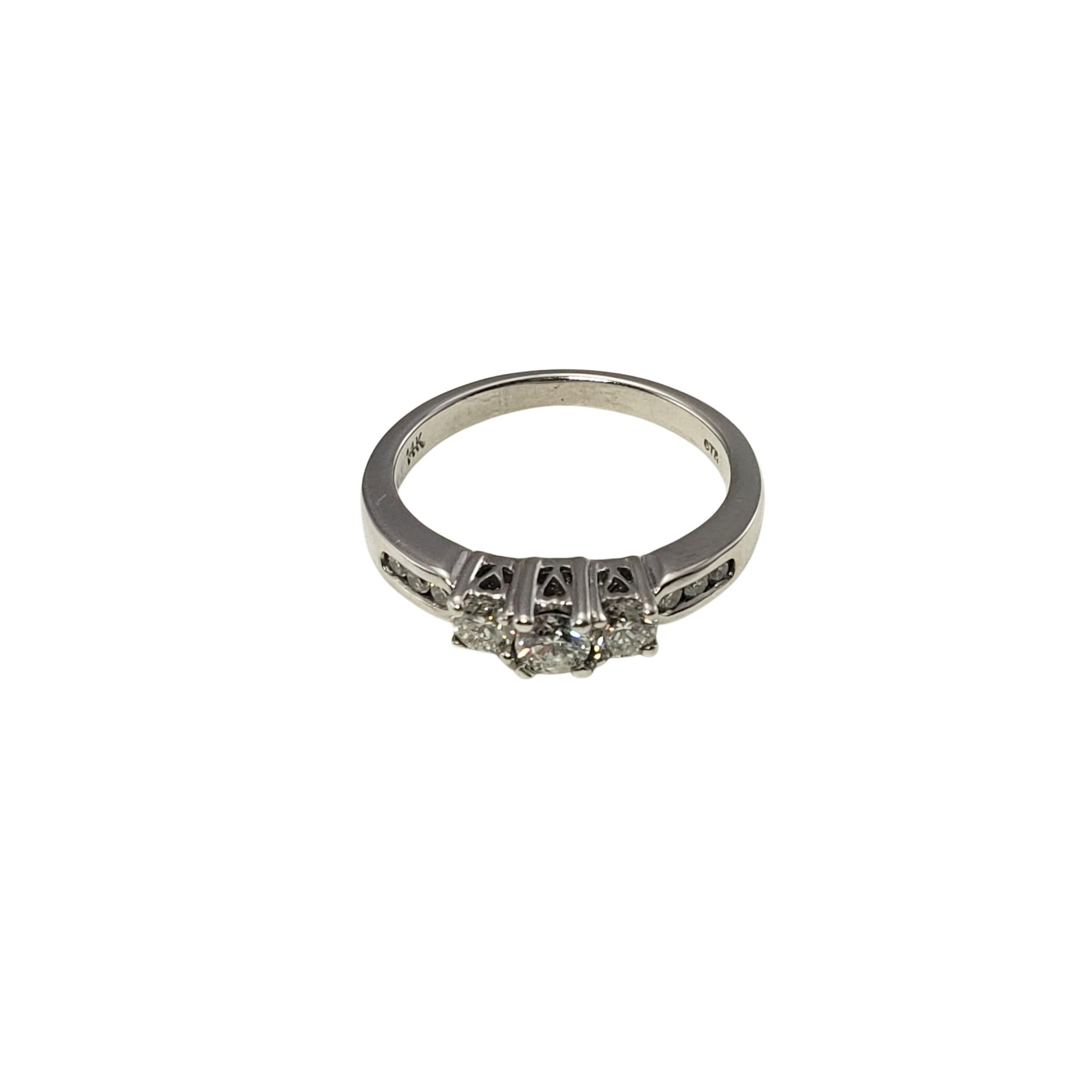 14 Karat White Gold and Diamond Past Present Future Ring Size 5.5-

This sparkling ring features nine round brilliant cut diamonds (center: .12 ct., two side stones: .04 ct. each) set in beautifully detailed 14K white gold.  Inner engraving