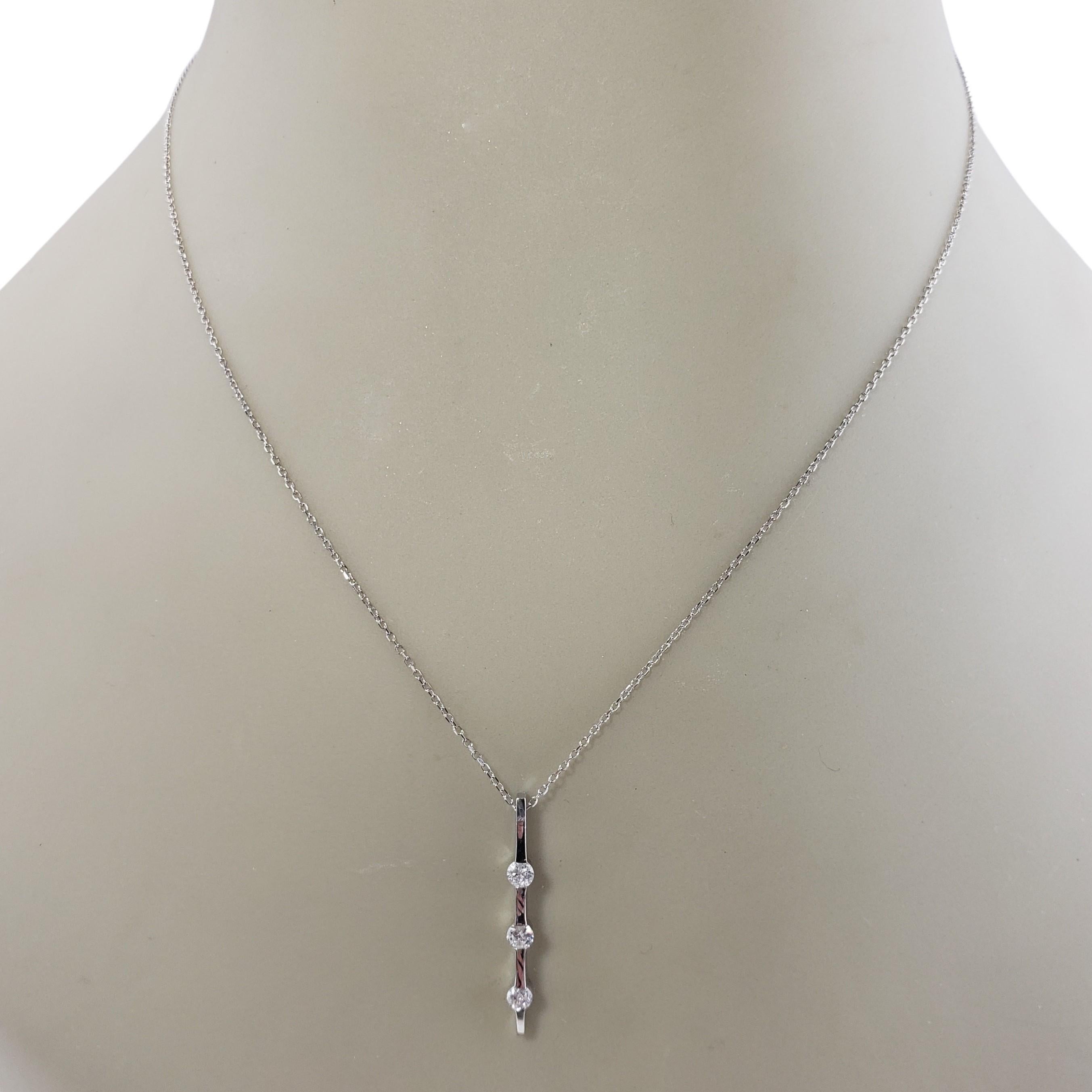 Vintage 14 Karat White Gold and Diamond Pendant Necklace-

This sparkling pendant features three round brilliant cut diamonds set in 14K white gold. Suspends from a classic cable chain.

Approximate total diamond weight: .21 ct.

Diamond clarity: