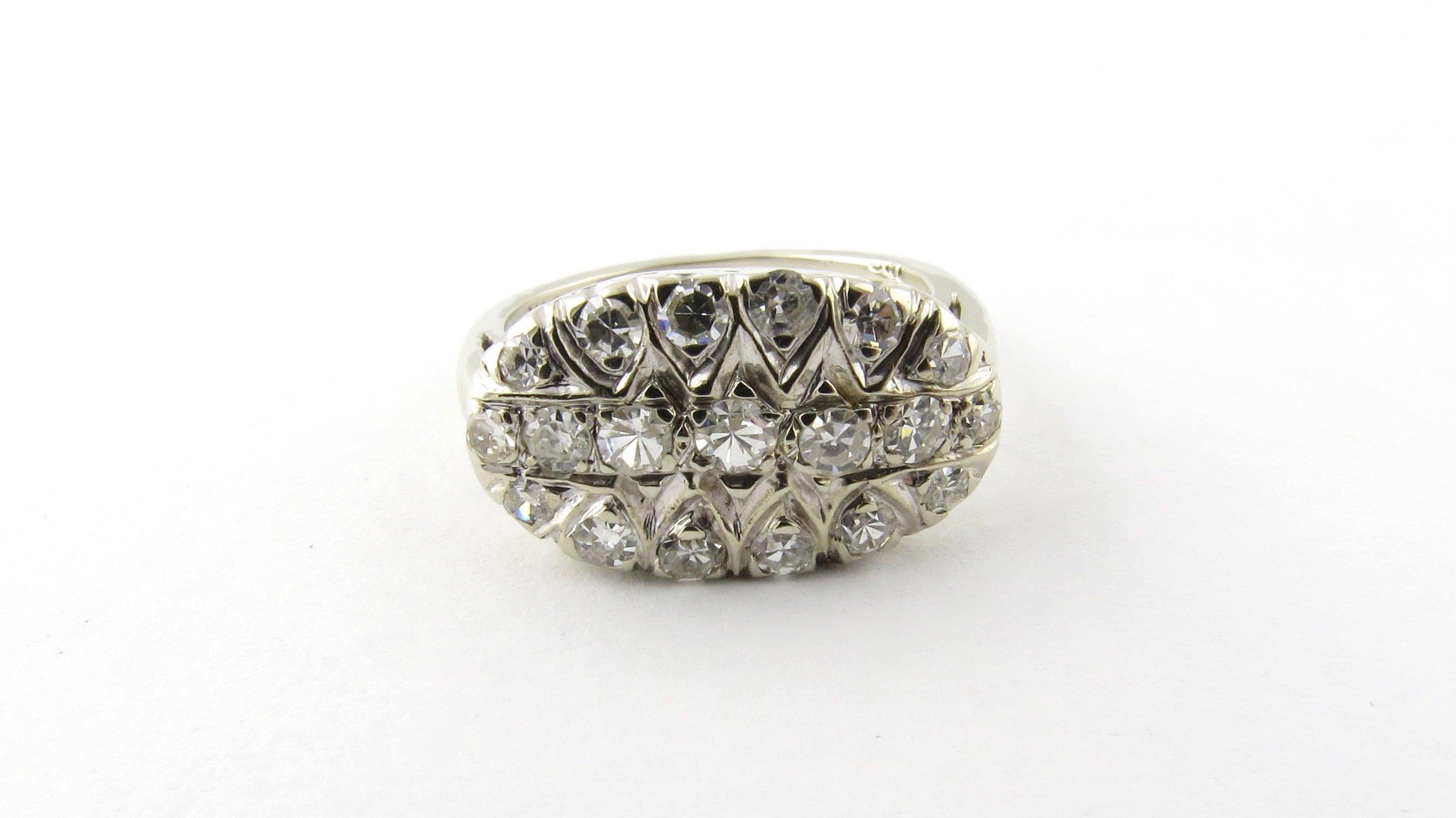 Vintage 14 Karat White Gold and Diamond Ring Size 6.5- 
This sparkling ring features 19 round single cut diamonds set in classic 14K white gold. Top of ring measures 11 mm x 18 mm. Shank measures .5 mm. *Some small chips noted to several stones. Not