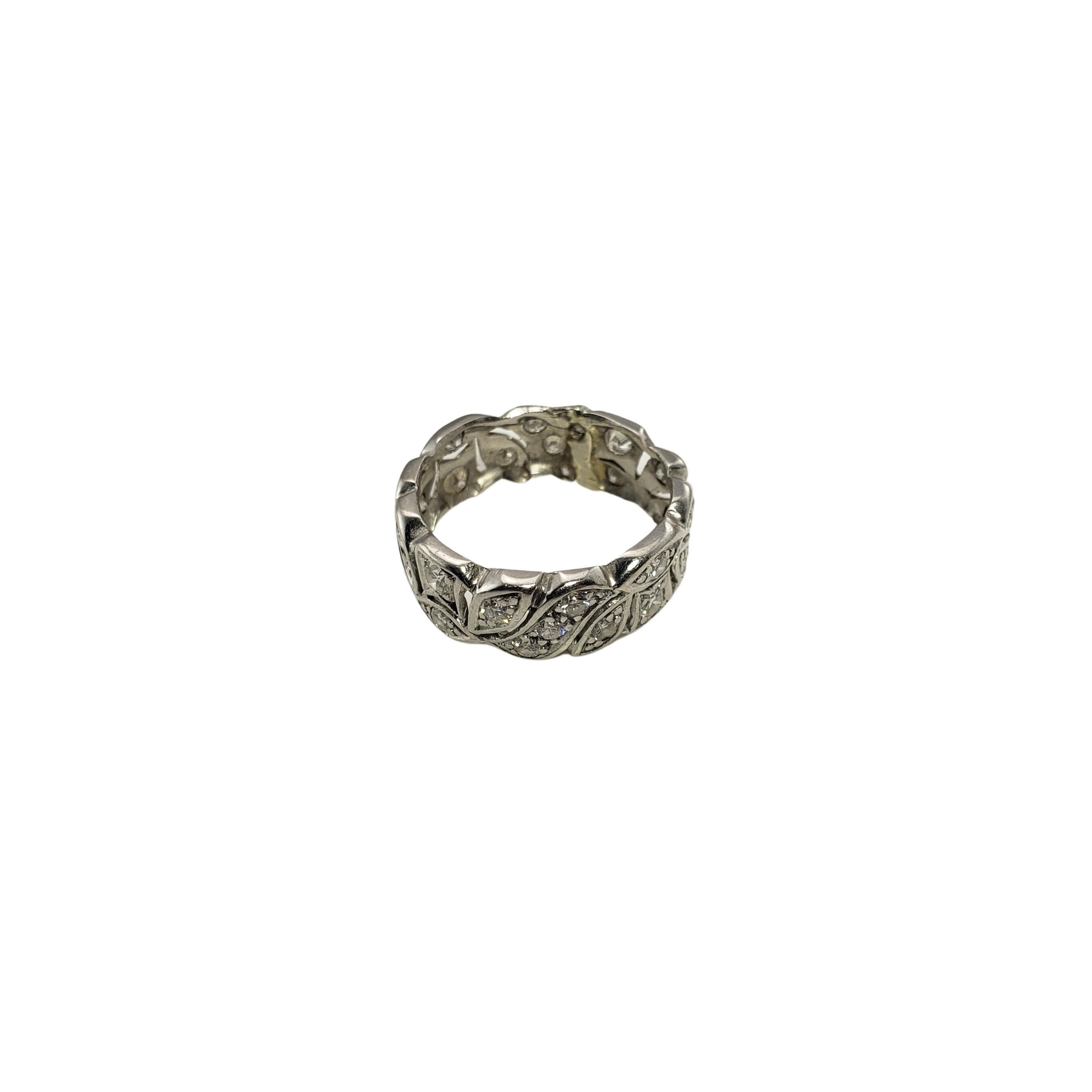 Vintage 14 Karat White Gold and Diamond Ring Size 6.25-

This sparkling band features 28 round brilliant cut diamonds set in beautifully detailed 14K white gold. Width: 7 mm.

Approximate total diamond weight: .45 ct.

Diamond color: G

Diamond