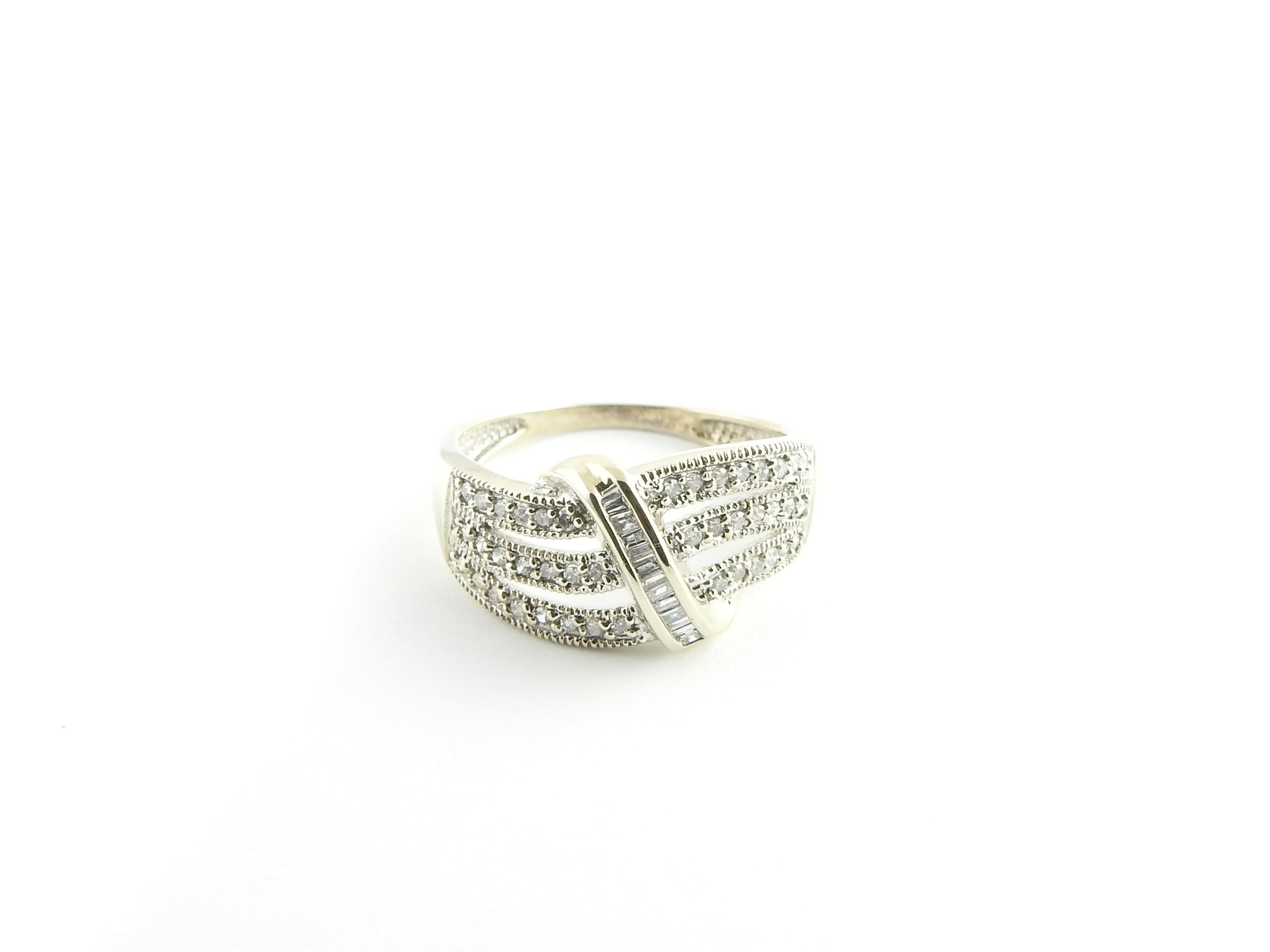 Vintage 14 Karat White Gold and Diamond Ring Size 7.25

This sparkling ring features 42 round single cut diamonds and 13 baguette diamonds set in classic 14K white gold. Width: 11 mm. Shank: 1.5 mm.

Approximate total diamond weight: .47