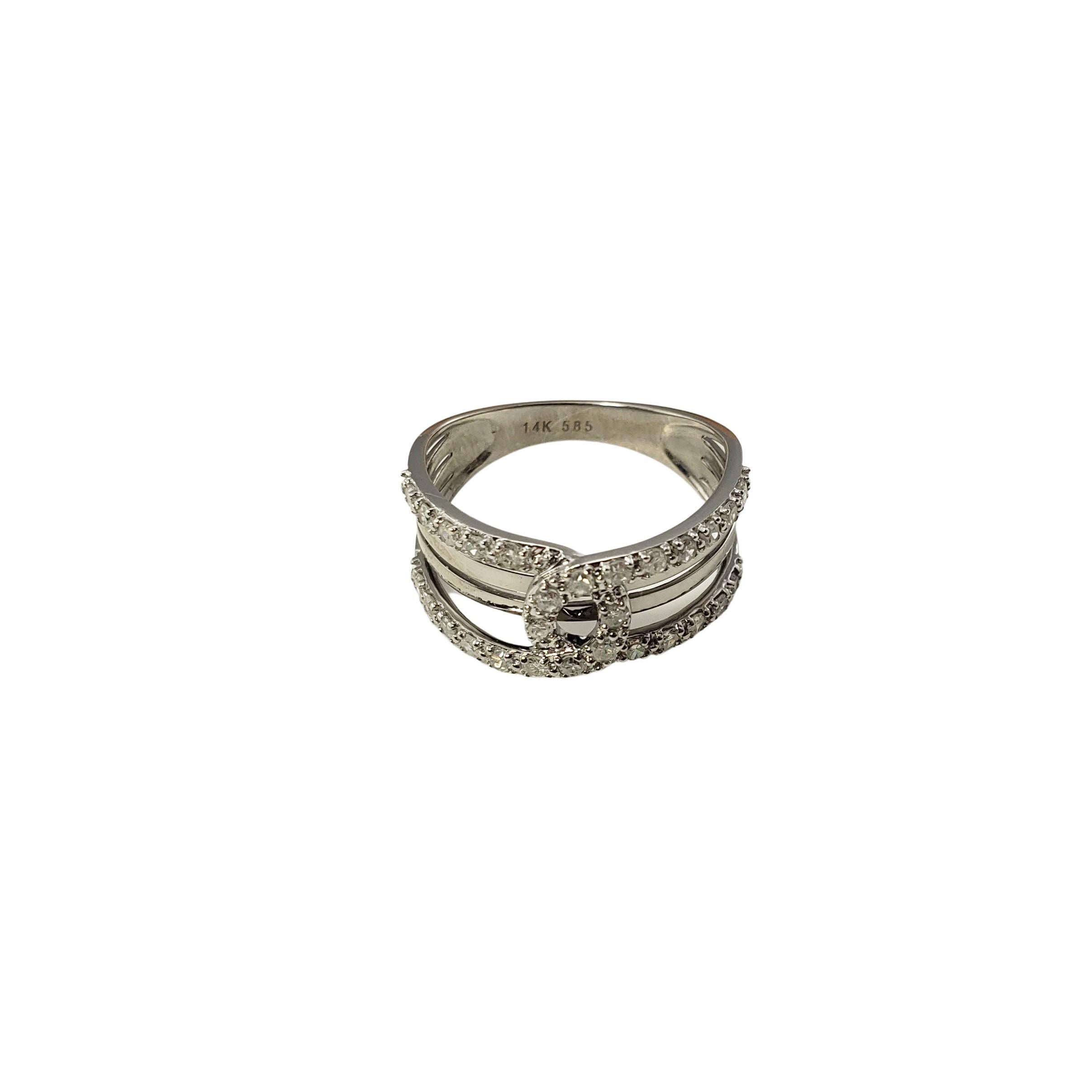 14 Karat White Gold and Diamond Ring Size 7.25-

This sparkling band features 28 round single cut diamonds set in beautifully detailed 14K white gold.  Width:  10 mm.  Shank:  3 mm.

Total diamond weight:  .50 ct.

Diamond color: I

Diamond clarity: