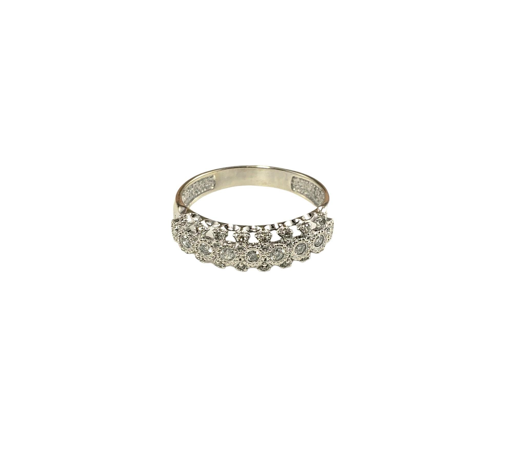 Vintage 14K White Gold and Diamond Ring Size 8-

This sparkling ring features 25 round and single cut diamonds set in beautifully detailed 14K white gold.  

Width: 6 mm.  

Shank: 3 mm.

Approximate total diamond weight: .26 ct.

Diamond color: