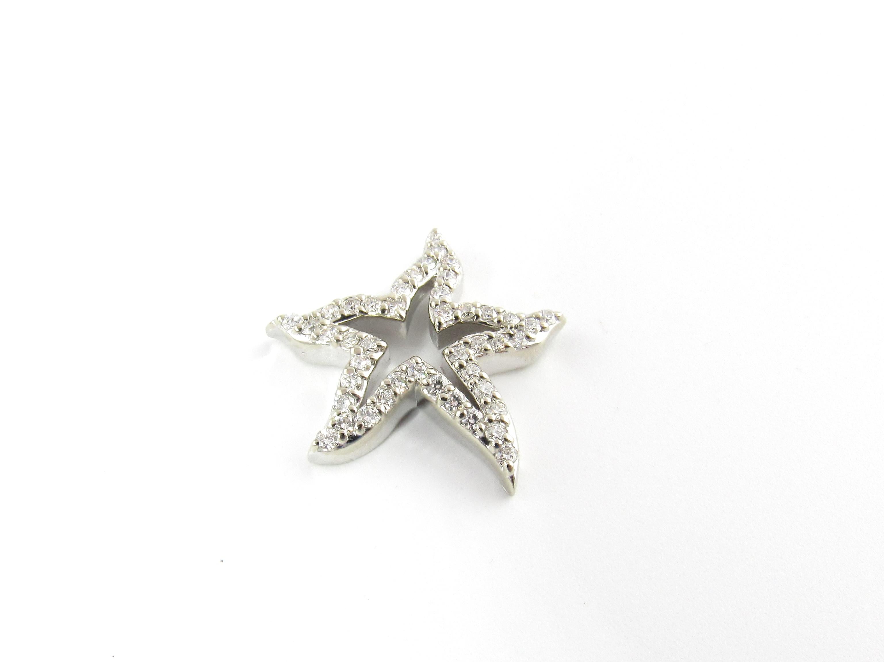 Vintage 14 Karat White Gold and Diamond Starfish Pendant

This sparkling pendant features a lovely starfish decorated with 44 round brilliant cut diamonds set in classic 14K white gold.

Approximate total diamond weight: .44 ct.

Diamond color: