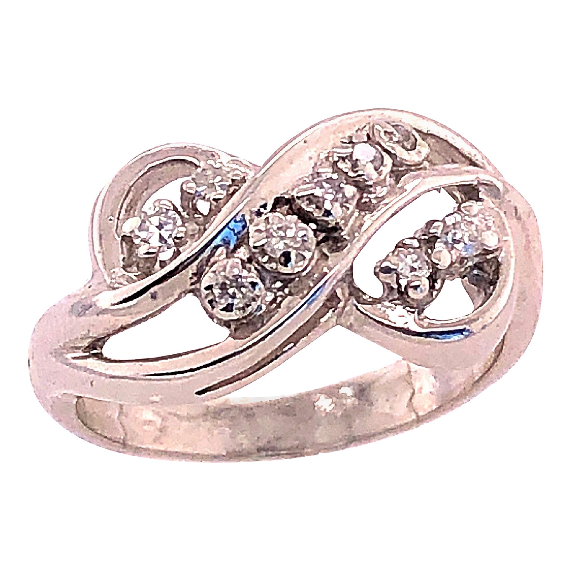 14 Karat White Gold and Diamond Swirl Ring For Sale