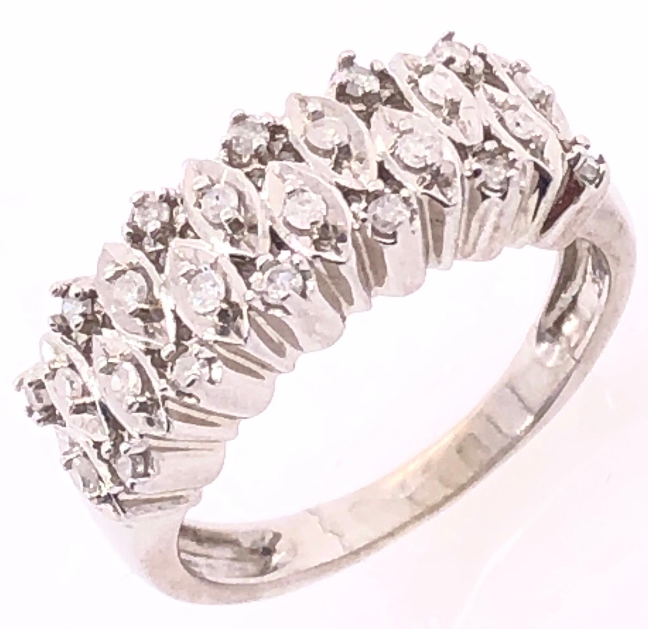 14 Karat White Gold Contemporary Ring with Diamonds.
0.72 total diamond weight.
Size 5.75
4 grams total weight.