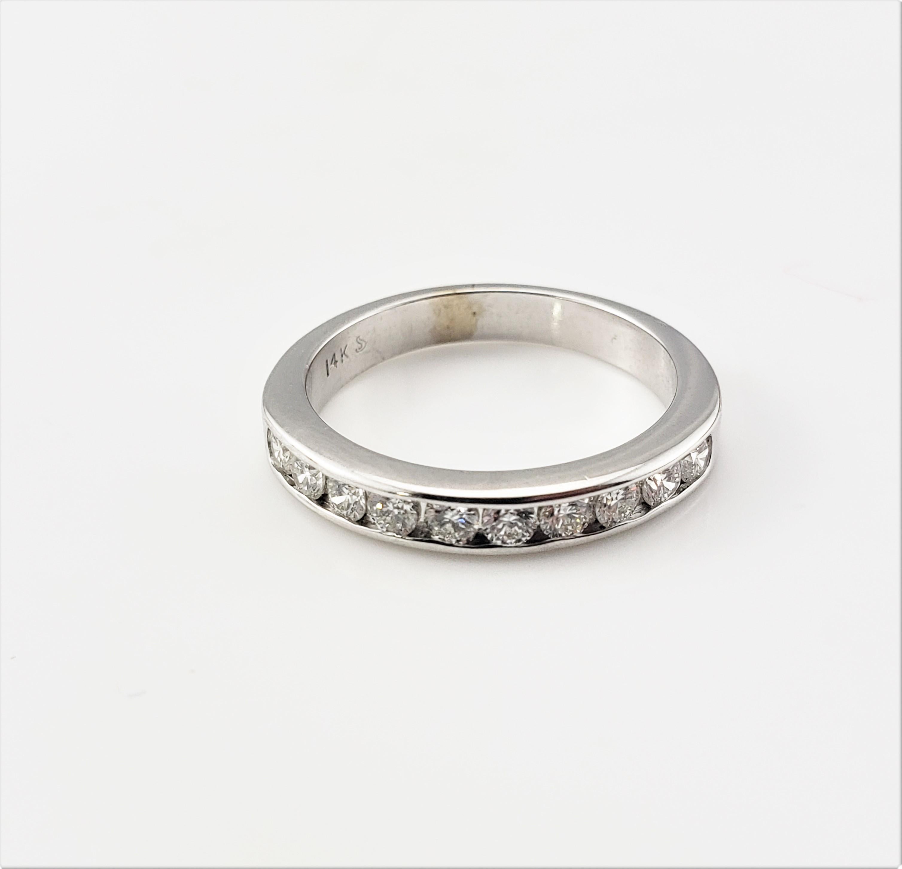 Vintage 14 Karat White Gold and Diamond Wedding Band Ring Size 7-

This sparkling wedding band features ten round brilliant cut diamonds set in classic 14K white gold. Width: 3 mm. Shank: 3 mm.

Approximate total diamond weight: .50 ct.

Diamond