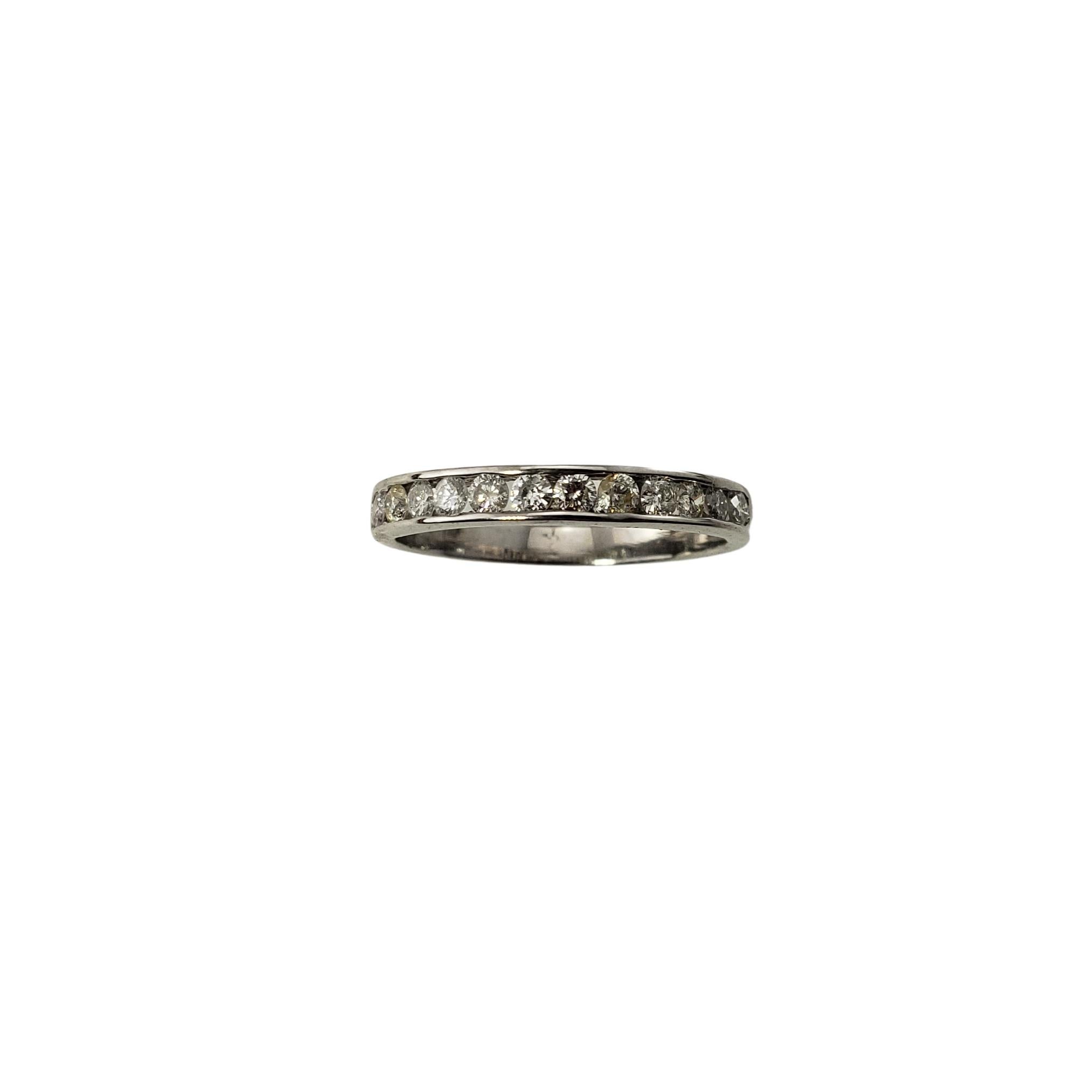 14 Karat White Gold and Diamond Wedding Band Ring Size 5.25-

This sparkling band features 12 round brilliant cut diamonds set in classic 14K white gold.  Width:  3 mm.

Approximate total diamond weight:  .36 ct.

Diamond color: H-I

Diamond