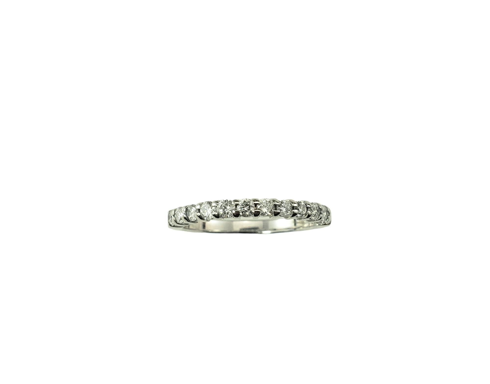 14 Karat White Gold and Diamond Wedding Band Ring Size 7

This sparkling band features 12 round brilliant cut diamonds* set in classic 14K white gold.  

*Chip noted to one diamond not visible to naked eye.

Approximate total diamond weight:  0.36