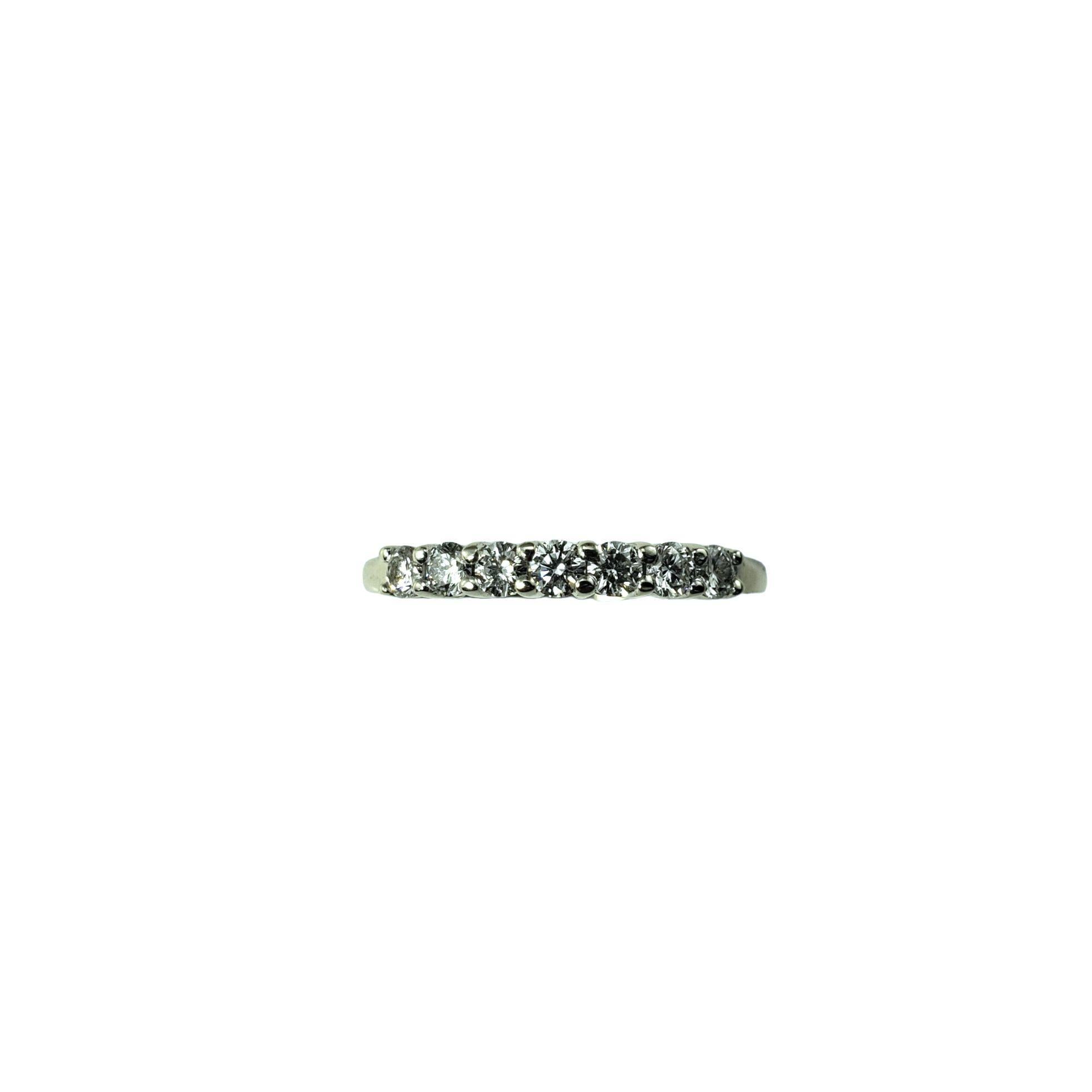14 Karat White Gold and Diamond Wedding Band Ring Size 8-

This sparkling band features seven round brilliant cut diamonds set in classic 14K white gold. Width: 2.5 mm. Shank: 2 mm.

Approximate total diamond weight: .49 ct.

Diamond