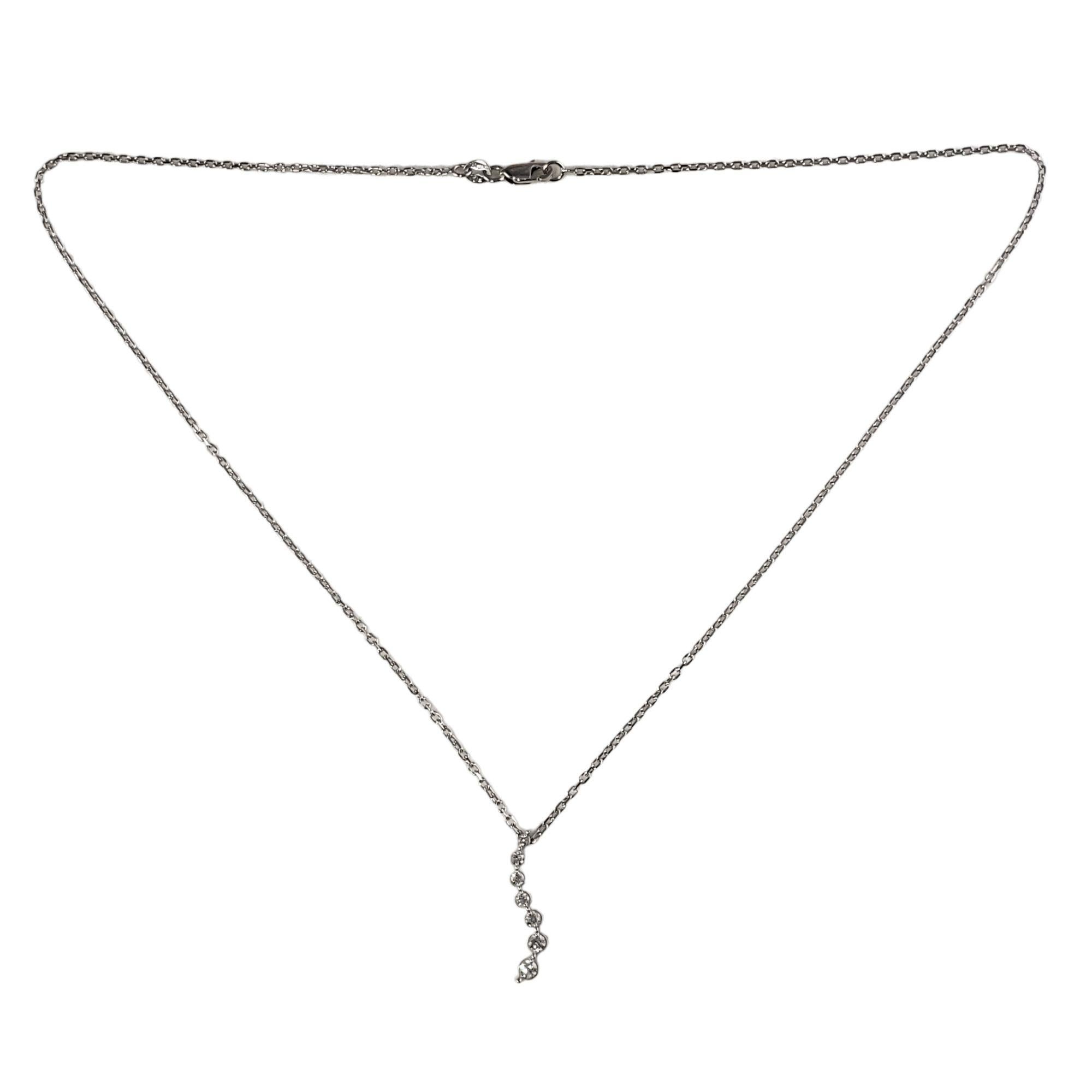 Vintage 14 Karat White Gold Graduated Diamond Pendant Necklace-

This lovely graduated diamond pendant features seven round brilliant cut diamonds set in 14K white gold. Suspends from a classic cable chain.

Approximate total diamond weight: .20