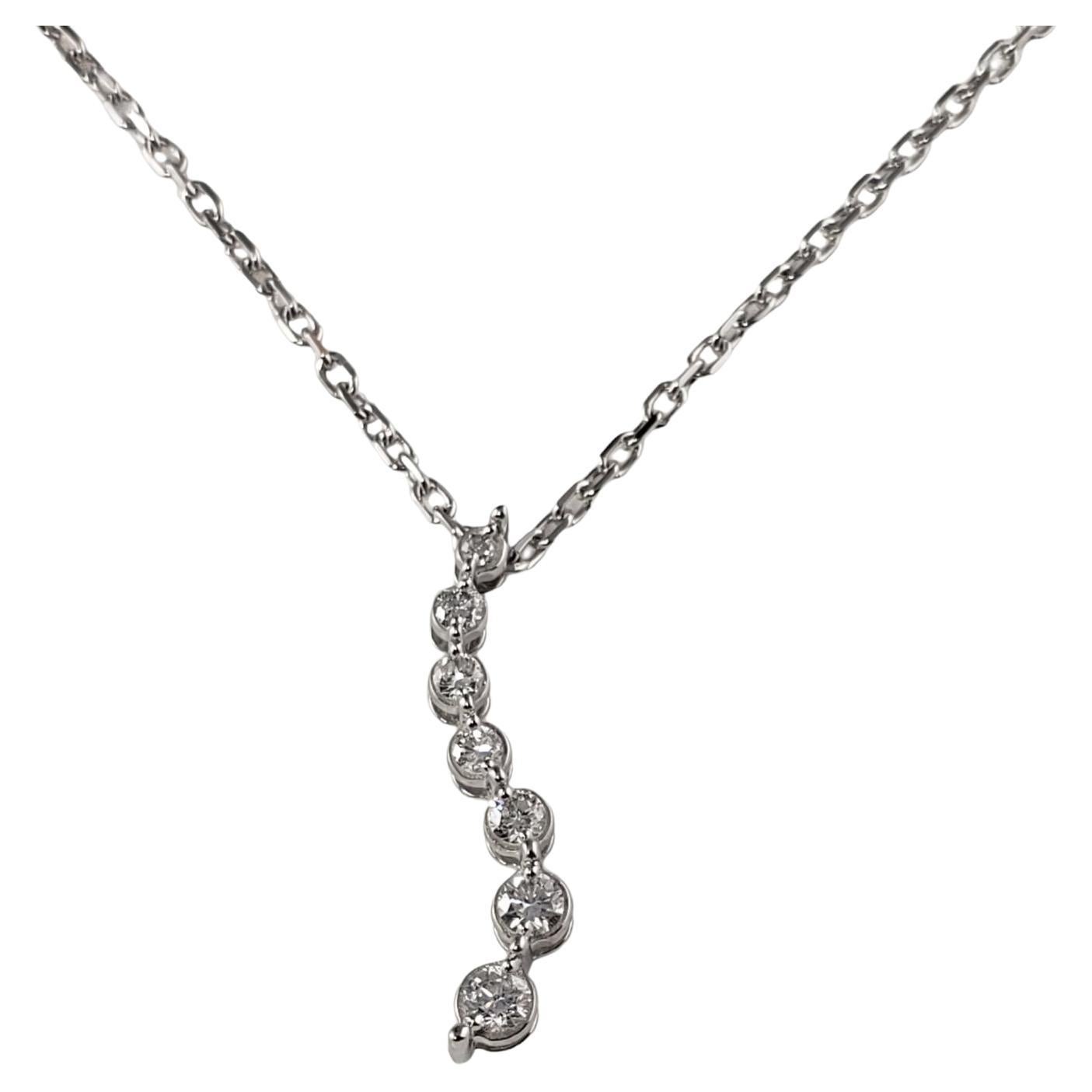 14 Karat White Gold and Graduated Diamond Pendant Necklace For Sale