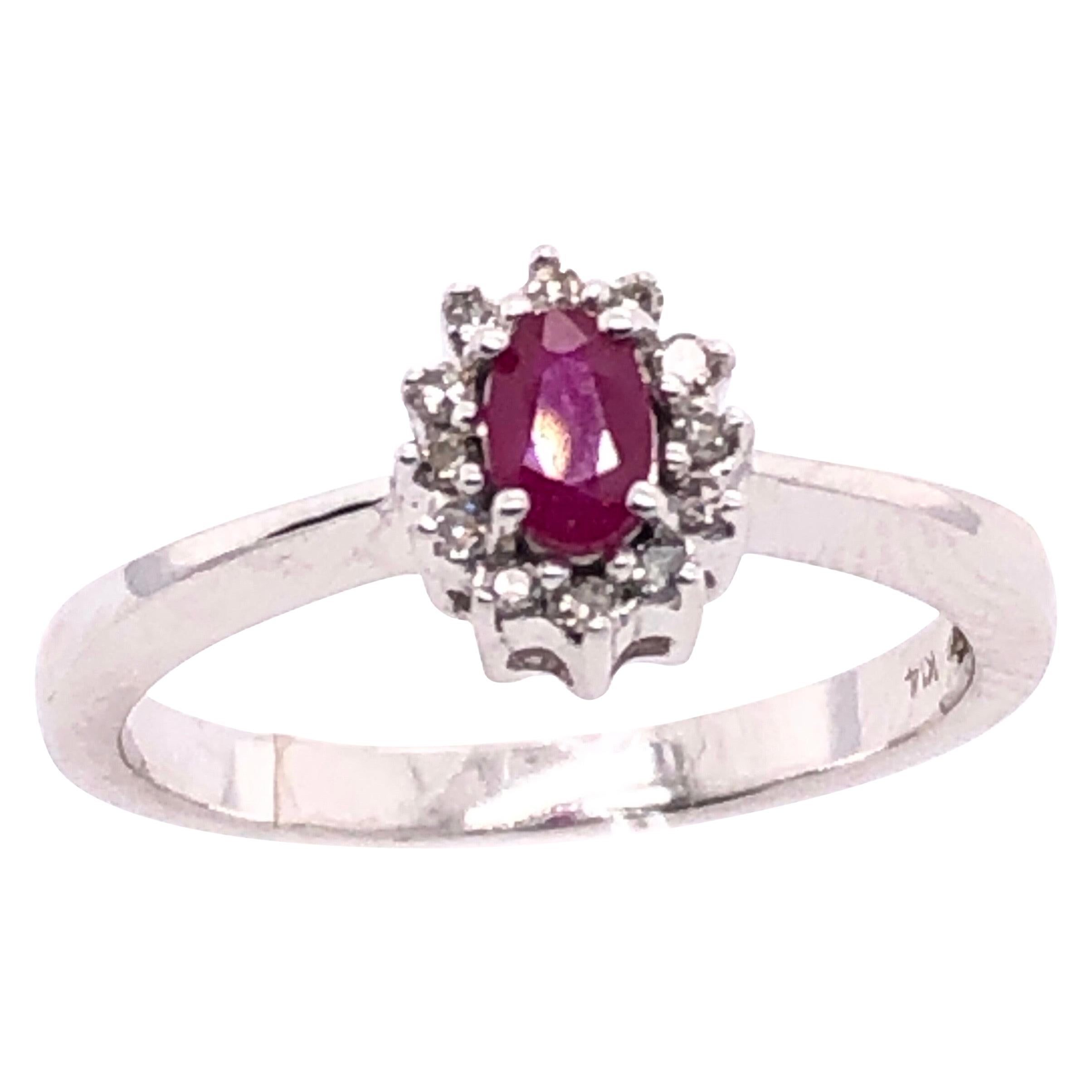 14 Karat White Gold and Ruby Ring Surrounded by Diamonds For Sale