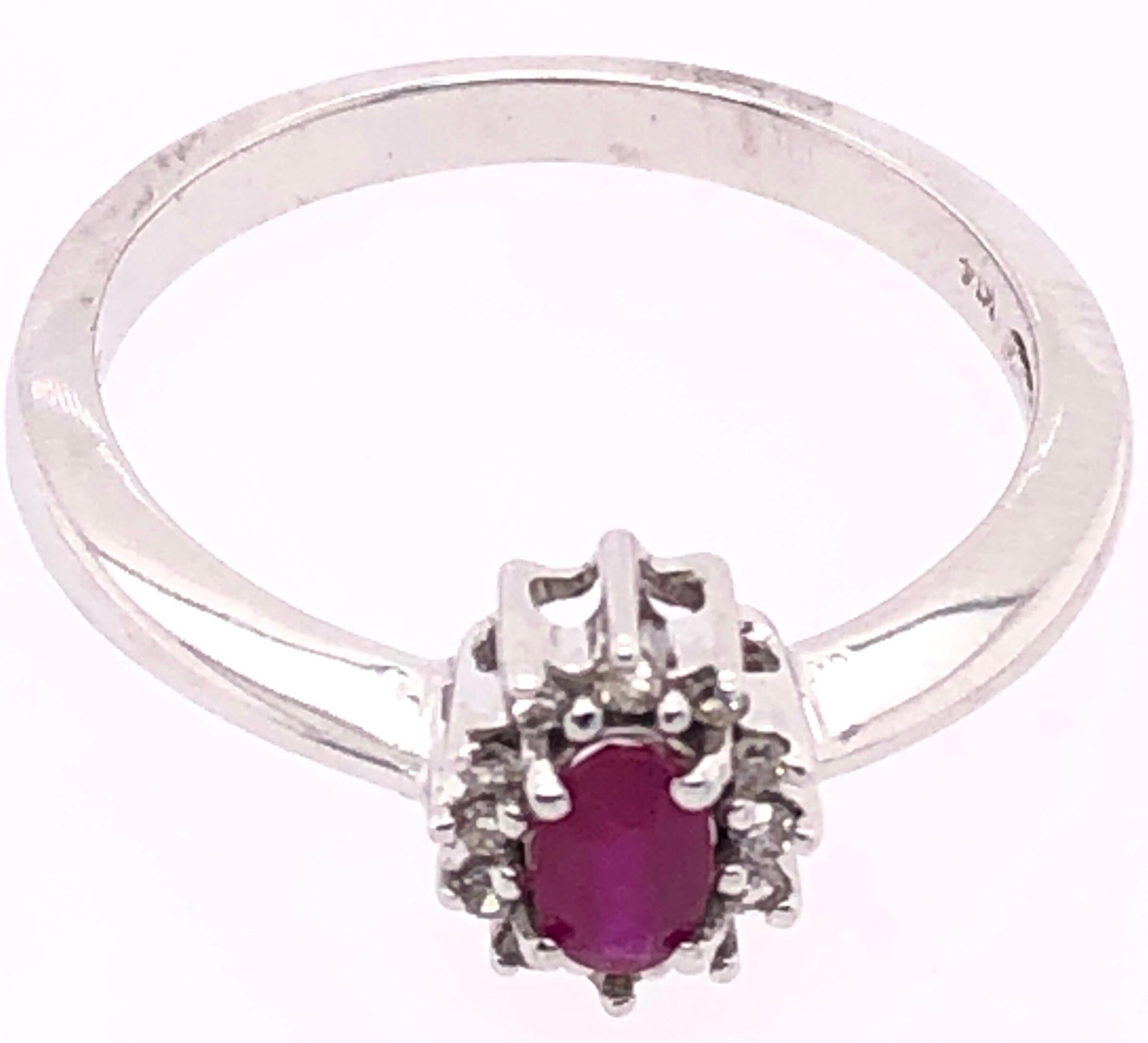 14 Karat White Gold Fashion Ruby Ring with Diamonds.
0.50 total diamond weight.
Size 6.5
2.92 grams total weight.