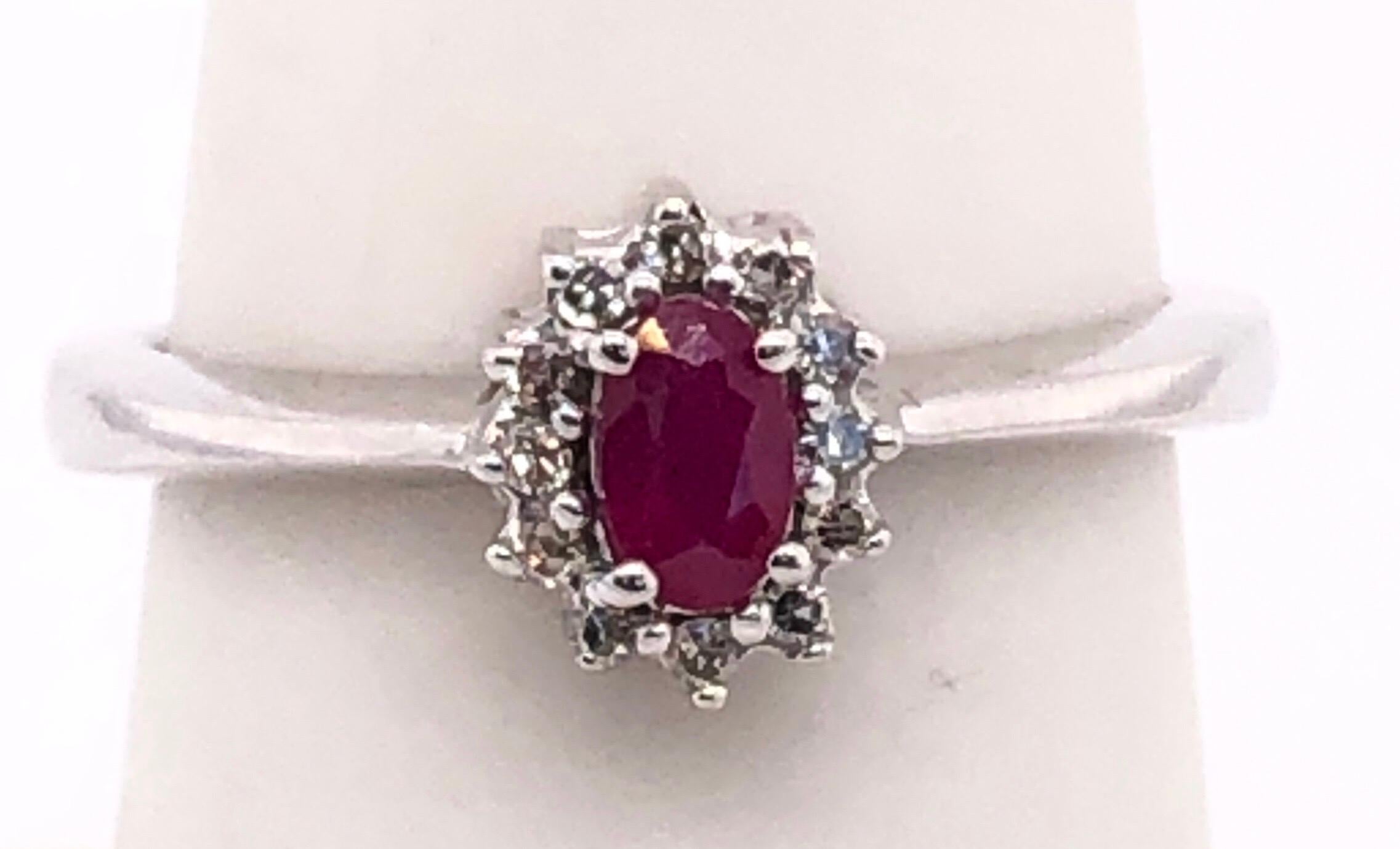 Women's or Men's 14 Karat White Gold and Ruby Ring Surrounded by Diamonds For Sale