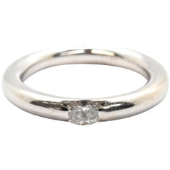 14 Karat White Gold and Tension-Set 0.25 Carat Oval Diamond Band Ring