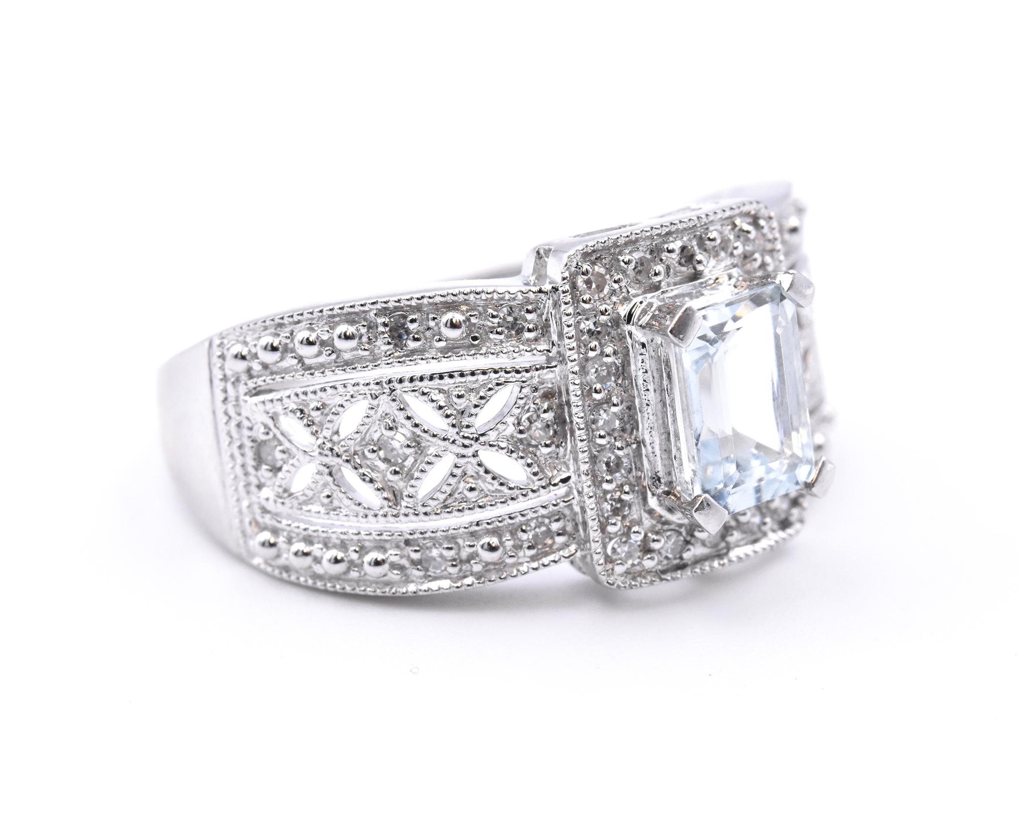 Designer: custom
Material: 14K white gold
Aquamarine: 1 emerald cut = .89ct
Diamond: 34 round cut = .17cttw
Color: H
Clarity: SI2
Ring Size: 10 (please allow up to  additional business days for sizing requests)
Dimensions: ring top measures 12.2mm