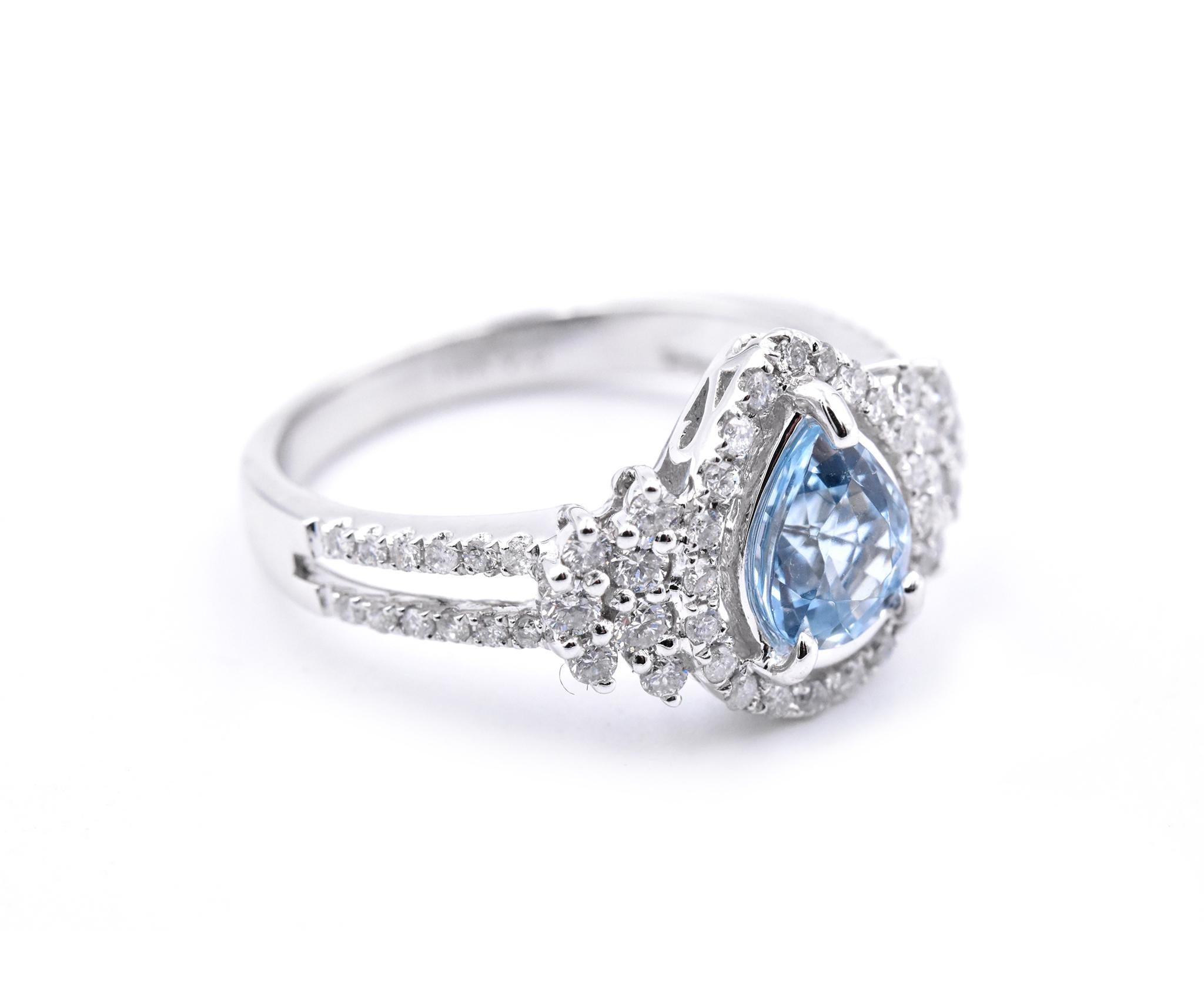 Designer: custom design
Material: 14k white gold
Gemstones: Pear Cut Aquamarine = .84ct
Certification: AGI 25342
Diamonds:   58 round brilliant cuts = .58cttw
Color: F
Clarity: VS2-SI
Ring Size: 7.5 (please allow two additional shipping days for