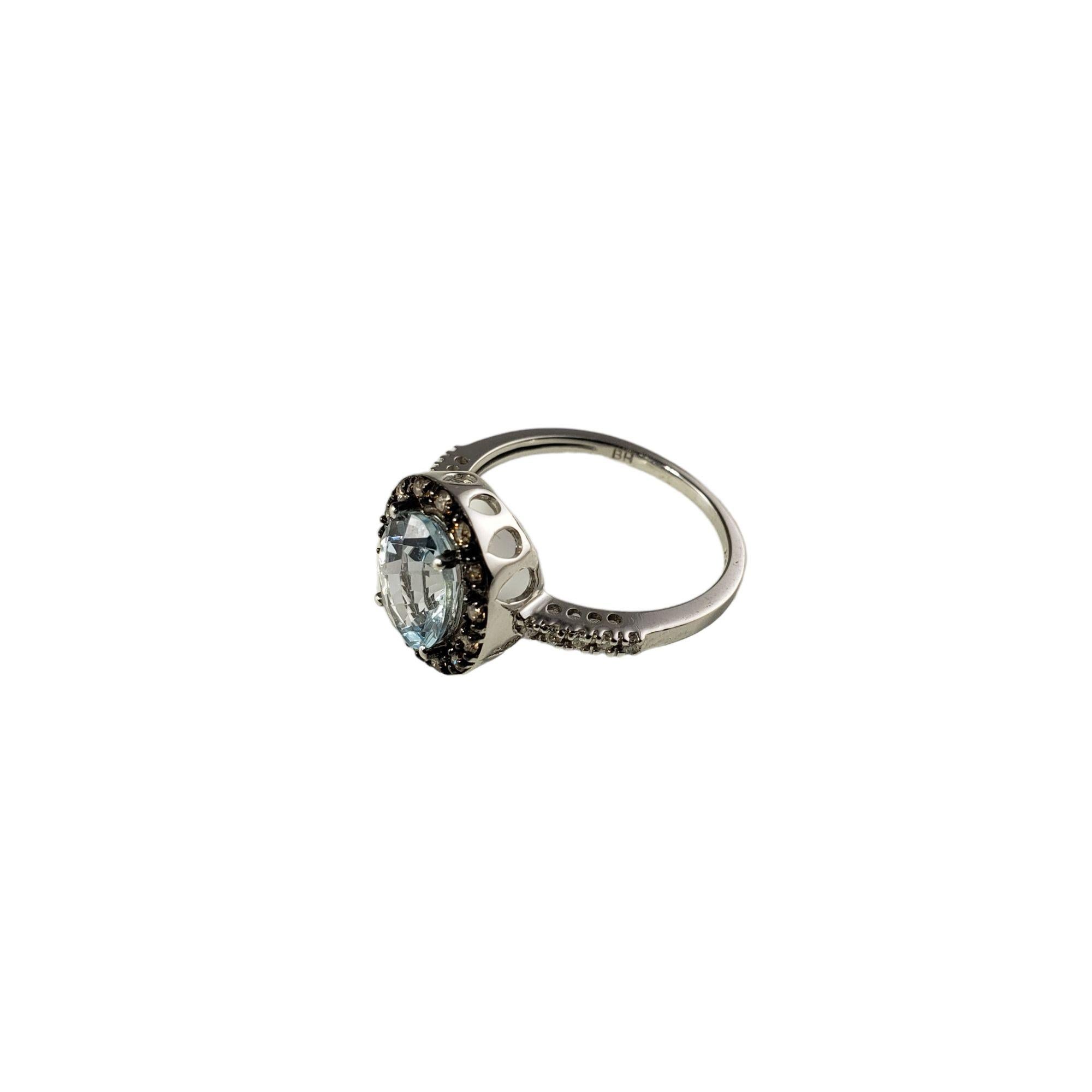 Vintage 14 Karat White Gold Aquamarine and Diamond Ring Size 7.25 JAGi Certified-

This stunning ring features one checkerboard oval cut aquamarine (9 mm x 7 mm) and 24 round brilliant and single cut diamonds set in classic 14K white gold. Width: 12