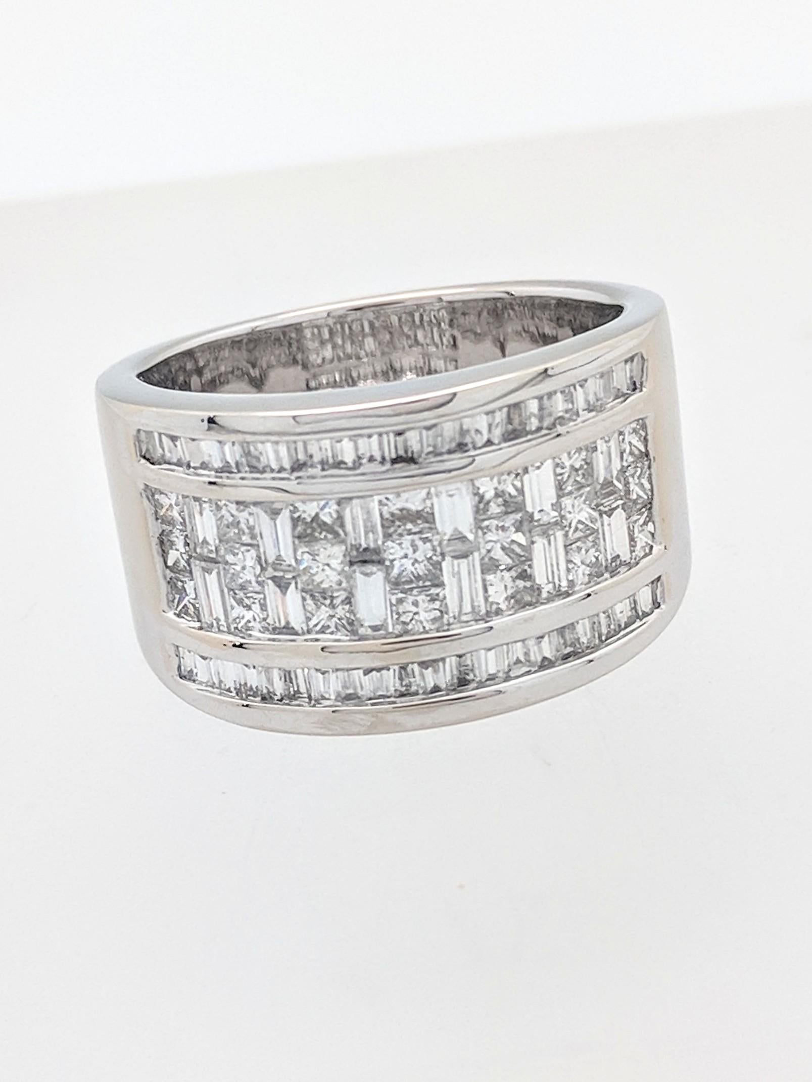 You are viewing a Beautiful Baguette & Princess Cut Diamond Wide Band.

This ring is crafted from 14k white gold and weighs 10.9 grams. It features natural baguette and princess cut diamonds for an estimated 3.0ctw. We estimate the diamonds to be