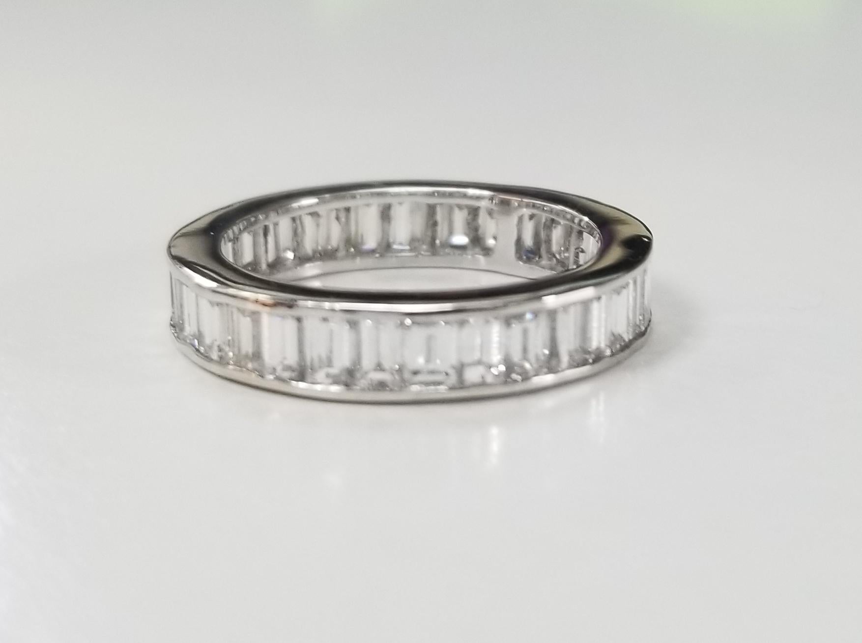14k white gold Baguette 4mm channel eternity ring, containing 39 straight baguette cut diamonds; color 