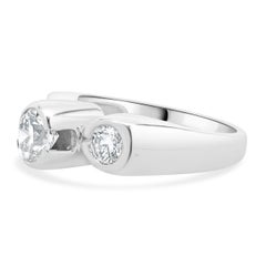 14 Karat White Gold Bezel Set Round Brilliant Cut Three Diamond Engagement Ring