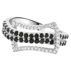 14 Karat White Gold Black and White Diamond Buckle Style Ring