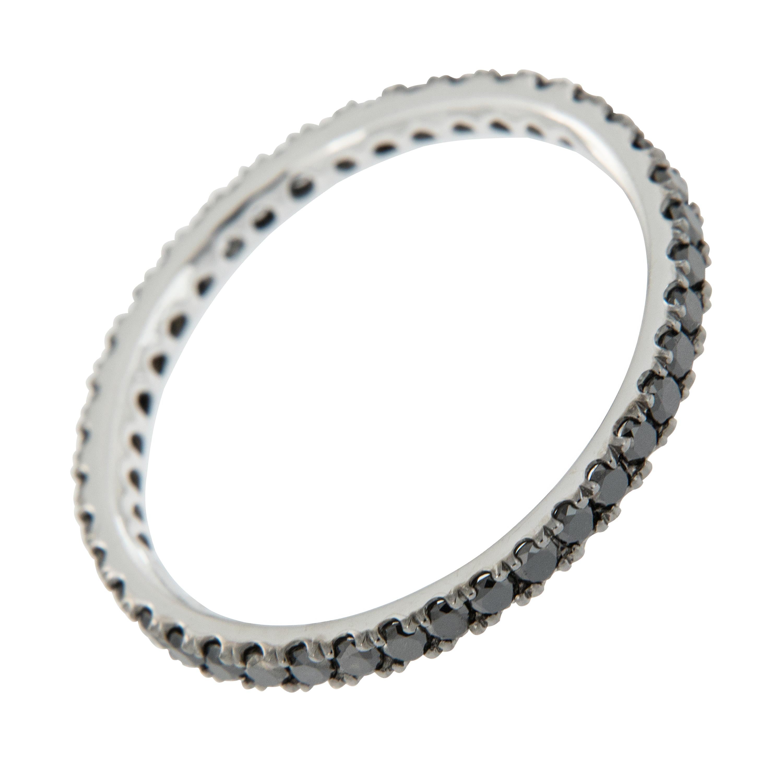 Tuxedo black diamonds accent this band all the way around so it always faces up beautifully! It can be worn alone or also looks fantastic stacked! Black goes with everything which makes this ring versatile. 14 karat white gold with 40 black diamonds