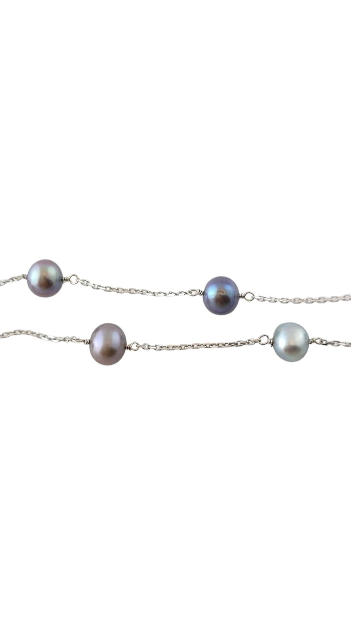 14 Karat White Gold Black Pearl Station Necklace

This gorgeous necklace is crafted from a 14K white gold link chain that features 12 stunning black freshwater pearls!

Approximate pearl size: 5.8mm

Chain length: 16